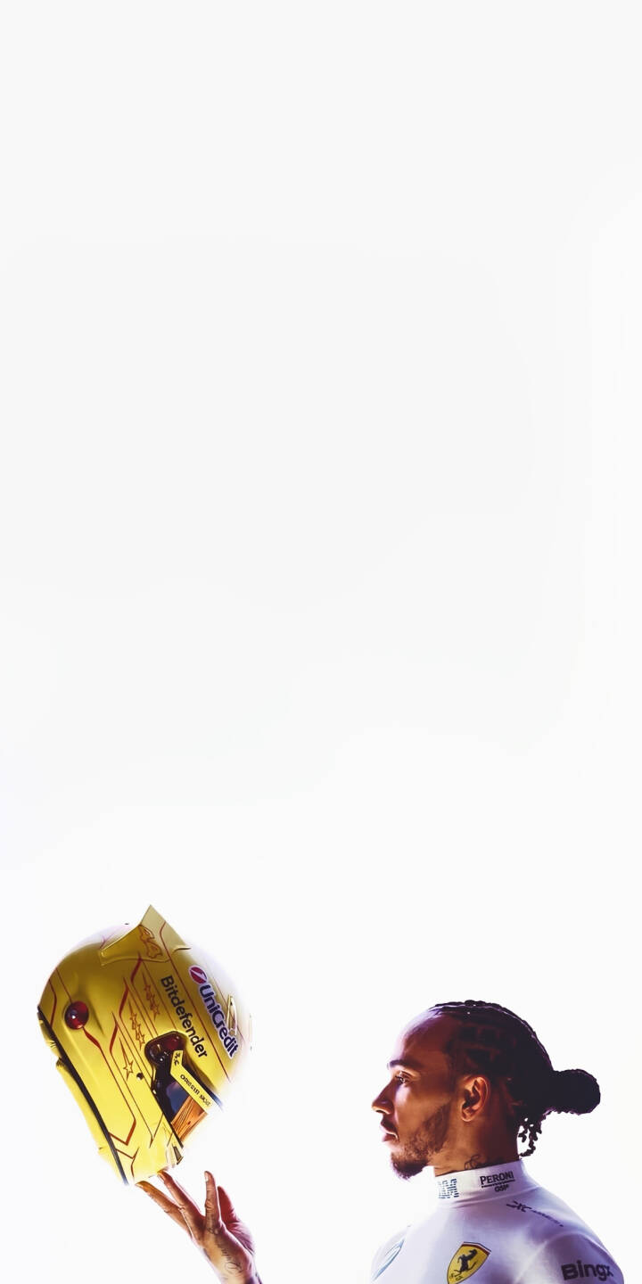 Lewis Hamilton thoughtfully holds his vibrant yellow racing helmet, adorned with sponsor logos, against a crisp white background in this striking 4K wallpaper. This dynamic wallpaper captures the F1 champion for your iPhone display. | iphone minimalist motorsport wallpaper f1 racing lewis hamilton formula 1 mobile 4k wallpaper hd wallpaper yellow helmet Lewis Hamilton thoughtfully holds his vibrant yellow racing helmet, adorned with sponsor logos, against a crisp white background in this striking 4K wallpaper. This dynamic wallpaper captures the F1 champion for your iPhone display.