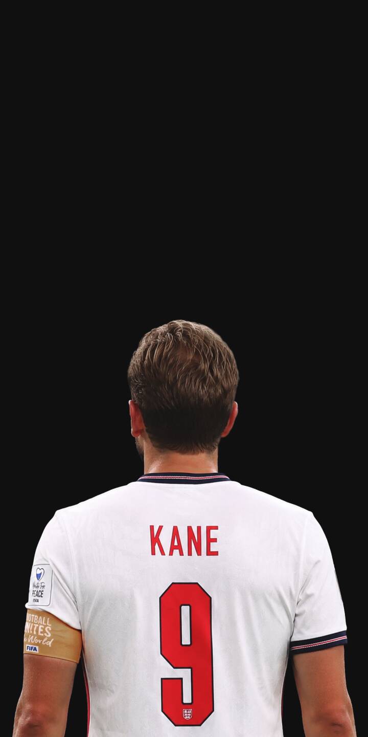 The iconic red number nine and "KANE" proudly adorn Harry Kane's white England jersey, standing out against a stark black backdrop in this stunning 4K wallpaper. Download this powerful football wallpaper for your iPhone and show your support. | football iphone soccer wallpaper kane jersey sport mobile 4k wallpaper hd wallpaper england harry kane The iconic red number nine and "KANE" proudly adorn Harry Kane's white England jersey, standing out against a stark black backdrop in this stunning 4K wallpaper. Download this powerful football wallpaper for your iPhone and show your support.