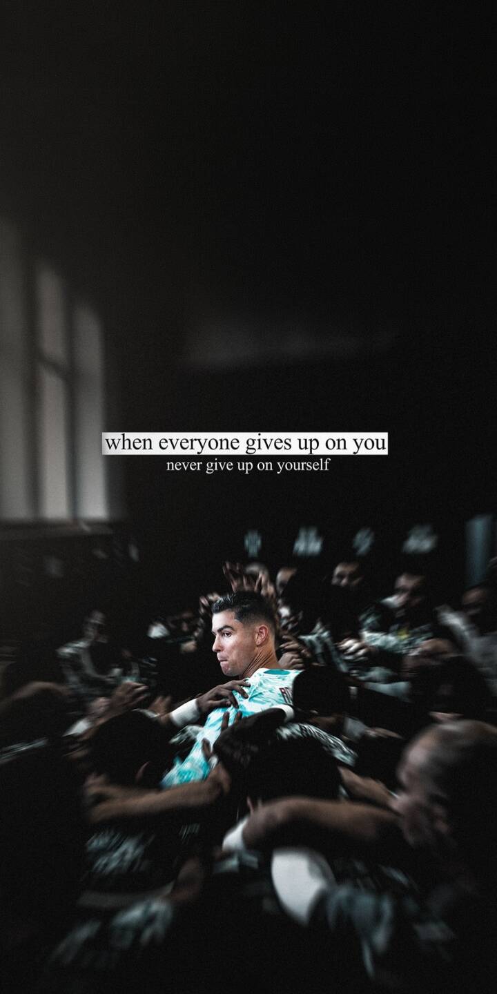 White motivational text, "when everyone gives up on you never give up on yourself," dramatically overlays a somber locker room scene featuring Cristiano Ronaldo with a determined expression amidst blurred figures. This powerful 4K wallpaper captures an inspiring moment, making it an excellent wallpaper choice for iPhone to fuel ambition. | football dark quote motivation iphone ronaldo wallpaper cristiano ronaldo mobile 4k wallpaper hd wallpaper inspirational White motivational text, "when everyone gives up on you never give up on yourself," dramatically overlays a somber locker room scene featuring Cristiano Ronaldo with a determined expression amidst blurred figures. This powerful 4K wallpaper captures an inspiring moment, making it an excellent wallpaper choice for iPhone to fuel ambition.
