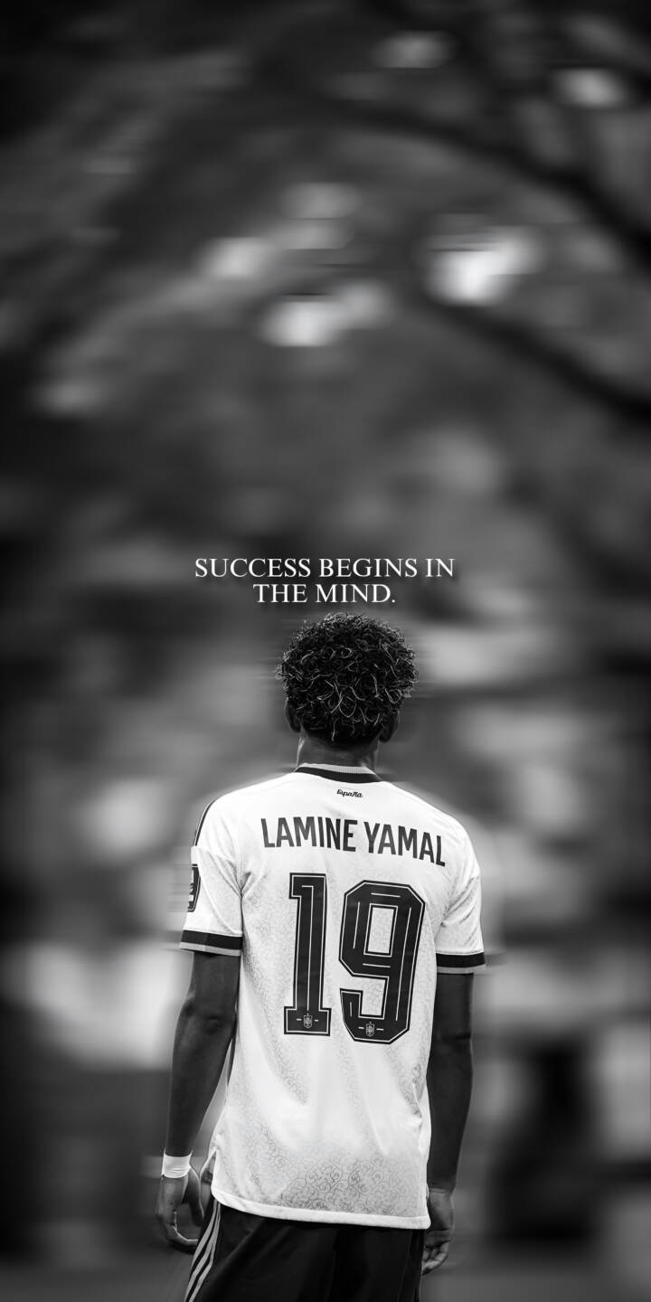 The inspiring text "SUCCESS BEGINS IN THE MIND." hovers above Lamine Yamal as he faces away in this compelling 4K wallpaper. This monochrome wallpaper, highlighting his iconic number 19 jersey, makes a powerful motivational statement for any iPhone screen. | football quote iphone soccer wallpaper black and white lamine yamal mobile 4k wallpaper hd wallpaper inspirational The inspiring text "SUCCESS BEGINS IN THE MIND." hovers above Lamine Yamal as he faces away in this compelling 4K wallpaper. This monochrome wallpaper, highlighting his iconic number 19 jersey, makes a powerful motivational statement for any iPhone screen.