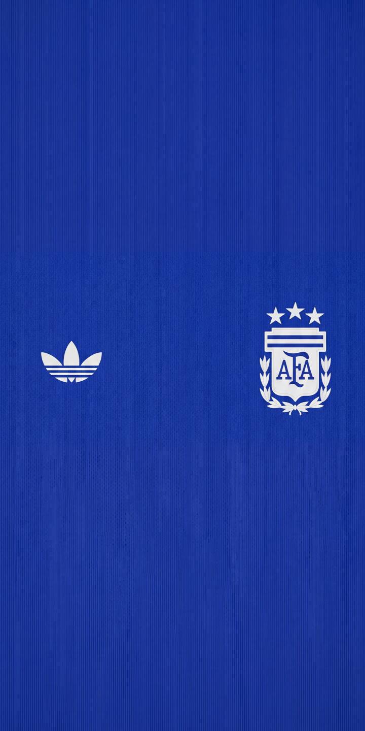 The deep royal blue fabric, featuring a subtle vertical ribbed texture, prominently displays the iconic white Adidas trefoil and Argentina AFA crest with three stars in this stunning 4K wallpaper — a perfect mobile wallpaper for any football fan's iPhone. | football blue iphone argentina soccer adidas wallpaper jersey mobile 4k wallpaper hd wallpaper afa The deep royal blue fabric, featuring a subtle vertical ribbed texture, prominently displays the iconic white Adidas trefoil and Argentina AFA crest with three stars in this stunning 4K wallpaper — a perfect mobile wallpaper for any football fan's iPhone.
