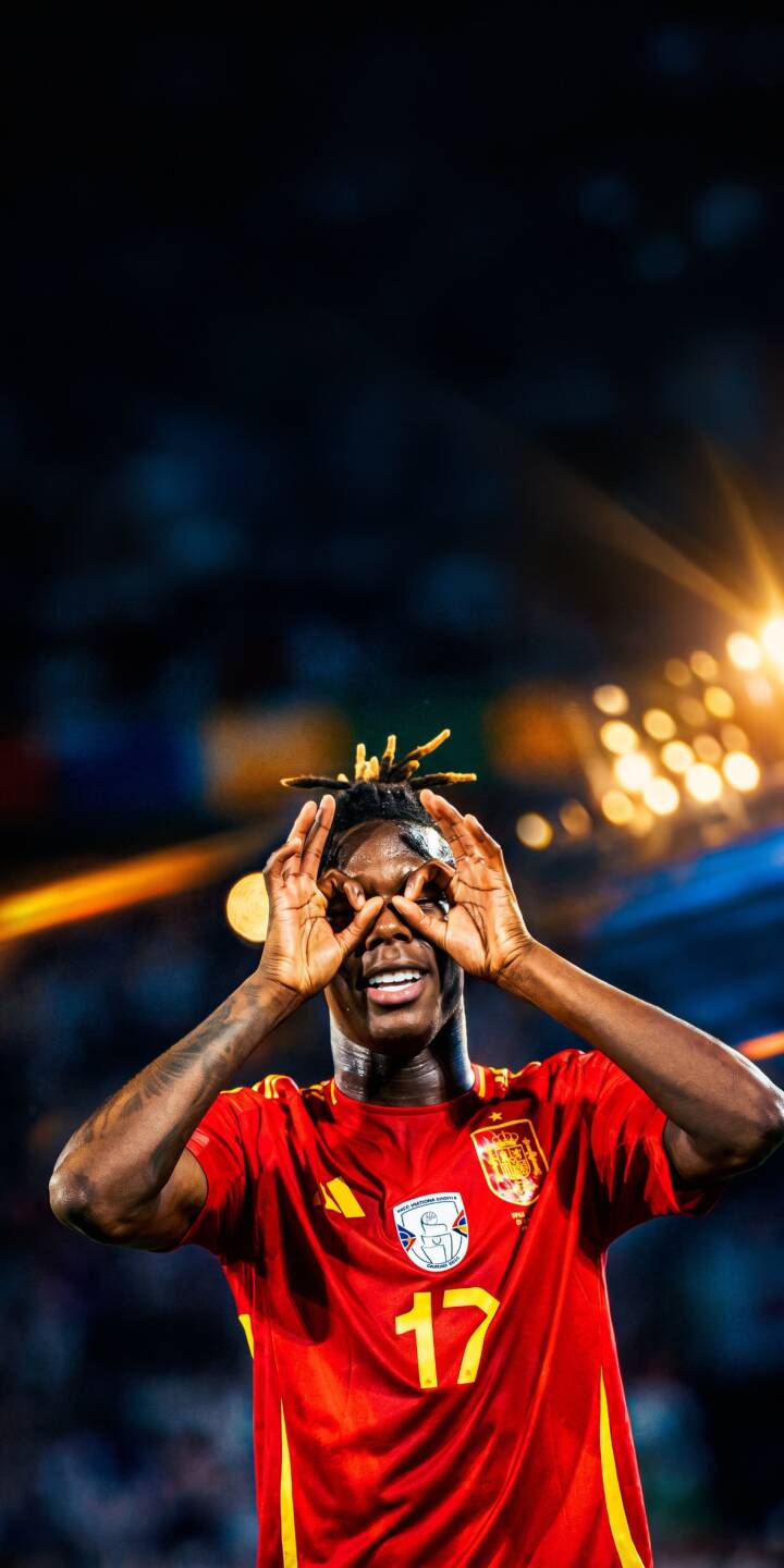 Nico Williams Jr. beams with a joyful smile, making his iconic 'goggles' celebration pose in his red Spain jersey in this vibrant 4K wallpaper — a perfect mobile wallpaper for iPhone to showcase your love for Spanish football. | sports celebration iphone barcelona wallpaper yamal lamine yamal soccer player mobile 4k wallpaper hd wallpaper spain football Nico Williams Jr. beams with a joyful smile, making his iconic 'goggles' celebration pose in his red Spain jersey in this vibrant 4K wallpaper — a perfect mobile wallpaper for iPhone to showcase your love for Spanish football.