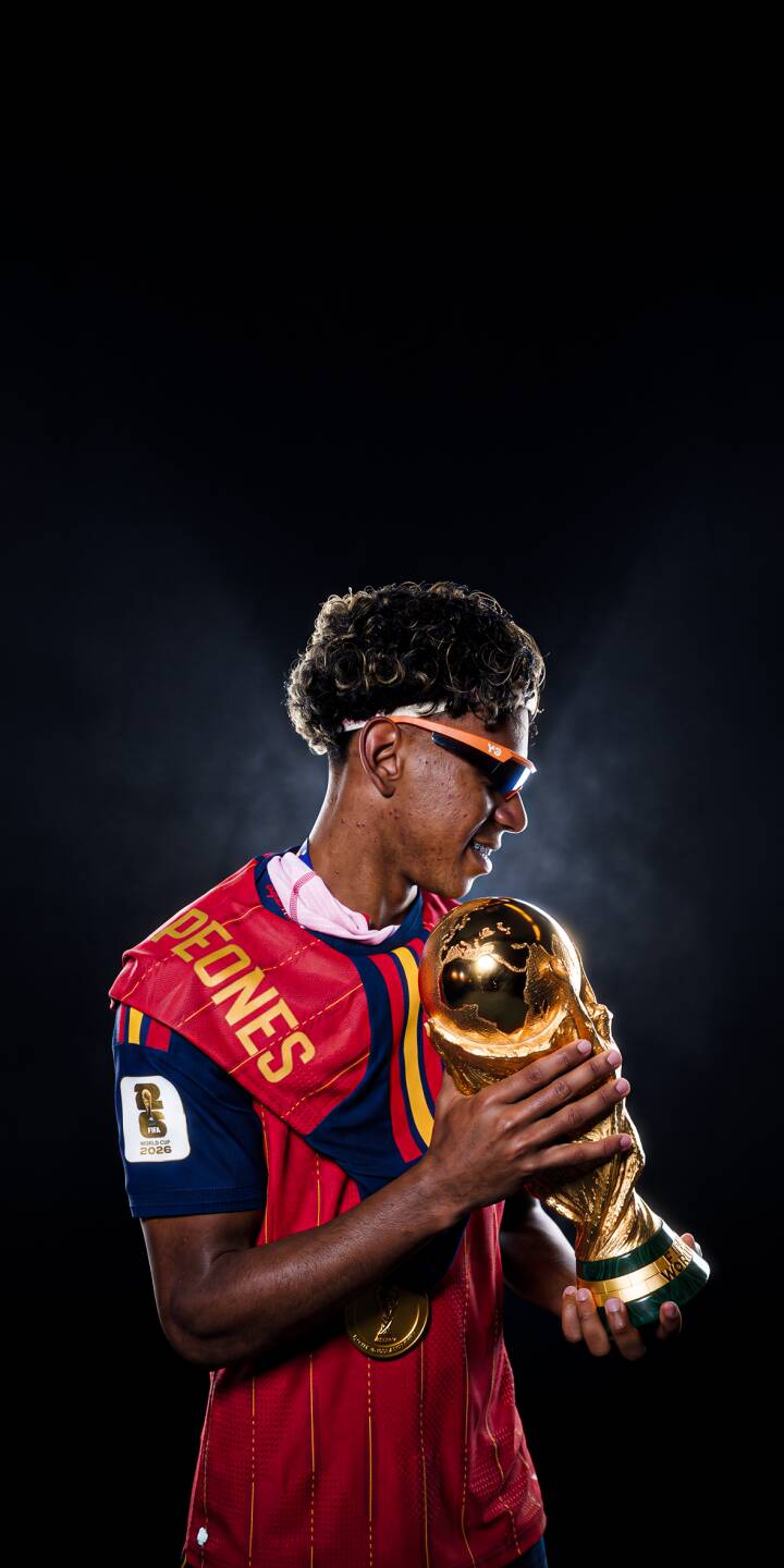 The golden World Cup trophy gleams in the hands of a smiling young football champion, donning stylish orange sunglasses in this stunning 4K wallpaper. This dynamic wallpaper is perfect for any iPhone to celebrate victory. | sports football player trophy celebration iphone wallpaper champion mobile 4k wallpaper hd wallpaper world cup The golden World Cup trophy gleams in the hands of a smiling young football champion, donning stylish orange sunglasses in this stunning 4K wallpaper. This dynamic wallpaper is perfect for any iPhone to celebrate victory.
