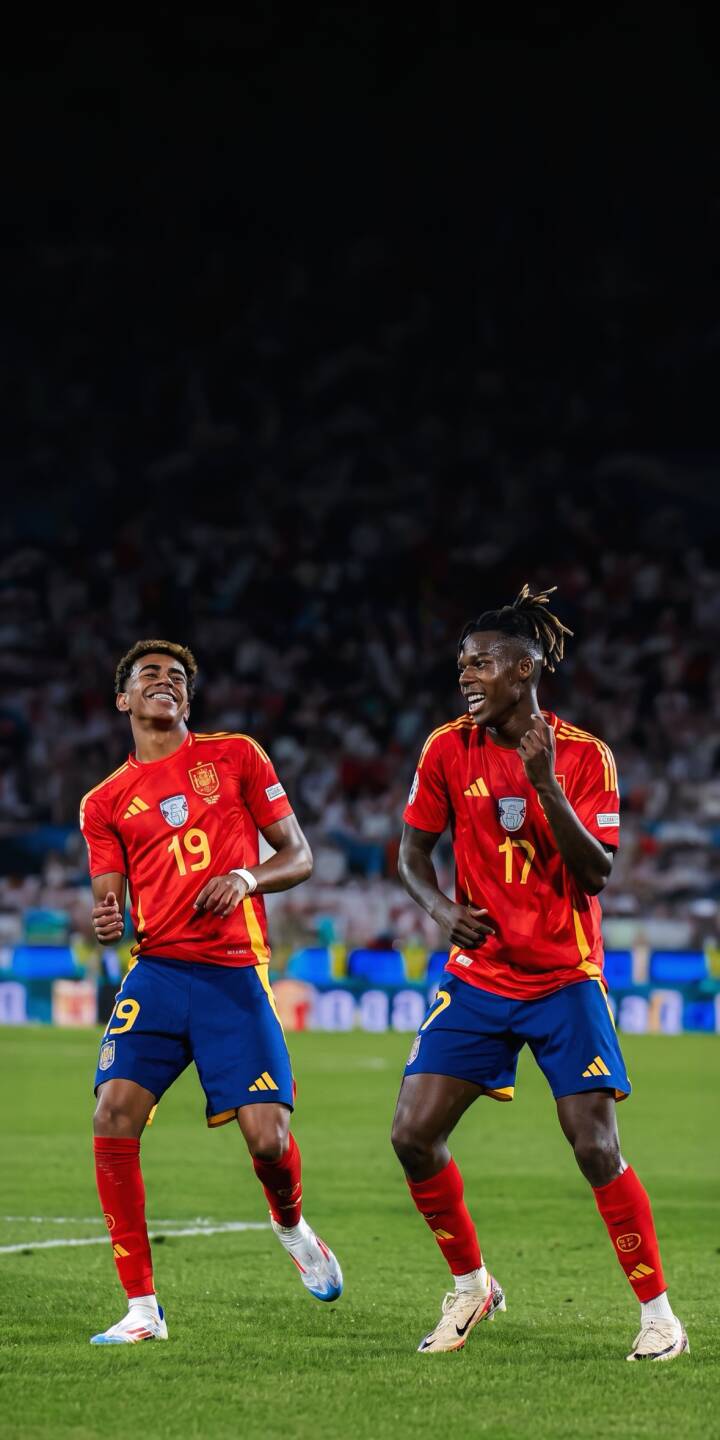 Lamine Yamal smiles brightly, celebrating a goal alongside his teammate Bryan Zaragoza, both sporting vibrant red and blue Spain football kits on the lush green pitch in this dynamic 4K wallpaper ",a must-have energetic celebration wallpaper for your iPhone." | sports celebration iphone soccer wallpaper lamine yamal mobile 4k wallpaper hd wallpaper spain football energetic bryan zaragoza Lamine Yamal smiles brightly, celebrating a goal alongside his teammate Bryan Zaragoza, both sporting vibrant red and blue Spain football kits on the lush green pitch in this dynamic 4K wallpaper ",a must-have energetic celebration wallpaper for your iPhone."