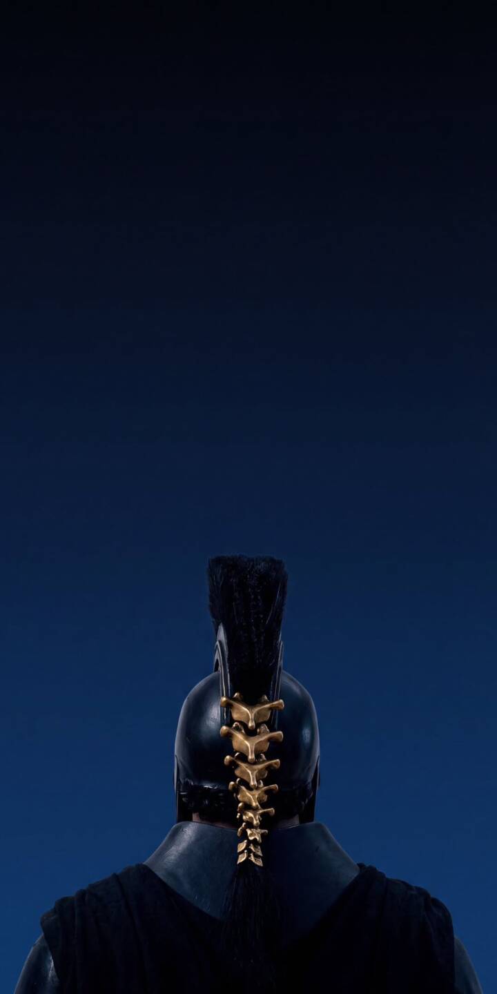 A golden, spine-like adornment shines against the dark helmet of a mysterious warrior, set against a deep blue gradient background in this striking 4K wallpaper. This powerful and enigmatic figure makes an impressive wallpaper for iPhone. | aesthetic warrior armor helmet iphone wallpaper dark blue mobile 4k wallpaper hd wallpaper mystic golden spine A golden, spine-like adornment shines against the dark helmet of a mysterious warrior, set against a deep blue gradient background in this striking 4K wallpaper. This powerful and enigmatic figure makes an impressive wallpaper for iPhone.