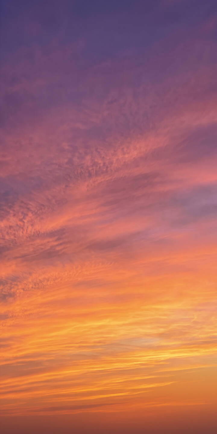 A breathtaking gradient of deep purple transitioning to fiery orange streaks across a serene sky in this stunning 4K wallpaper. This atmospheric cloud wallpaper creates a tranquil backdrop perfect for any iPhone screen. | sunset sky colorful iphone nature clouds wallpaper gradient vibrant mobile 4k wallpaper hd wallpaper A breathtaking gradient of deep purple transitioning to fiery orange streaks across a serene sky in this stunning 4K wallpaper. This atmospheric cloud wallpaper creates a tranquil backdrop perfect for any iPhone screen.