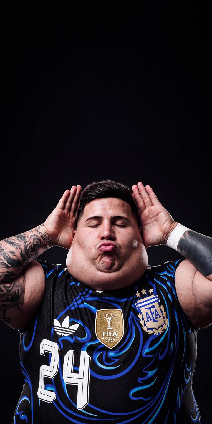 With puffed cheeks and hands by his ears, this enthusiastic Argentina fan makes a hilarious kissing face in this 4K wallpaper for iPhone. Perfect for supporters, this expressive wallpaper captures pure football joy against a sleek black backdrop. | meme funny iphone argentina soccer wallpaper mobile 4k wallpaper hd wallpaper expression world cup football fan With puffed cheeks and hands by his ears, this enthusiastic Argentina fan makes a hilarious kissing face in this 4K wallpaper for iPhone. Perfect for supporters, this expressive wallpaper captures pure football joy against a sleek black backdrop.