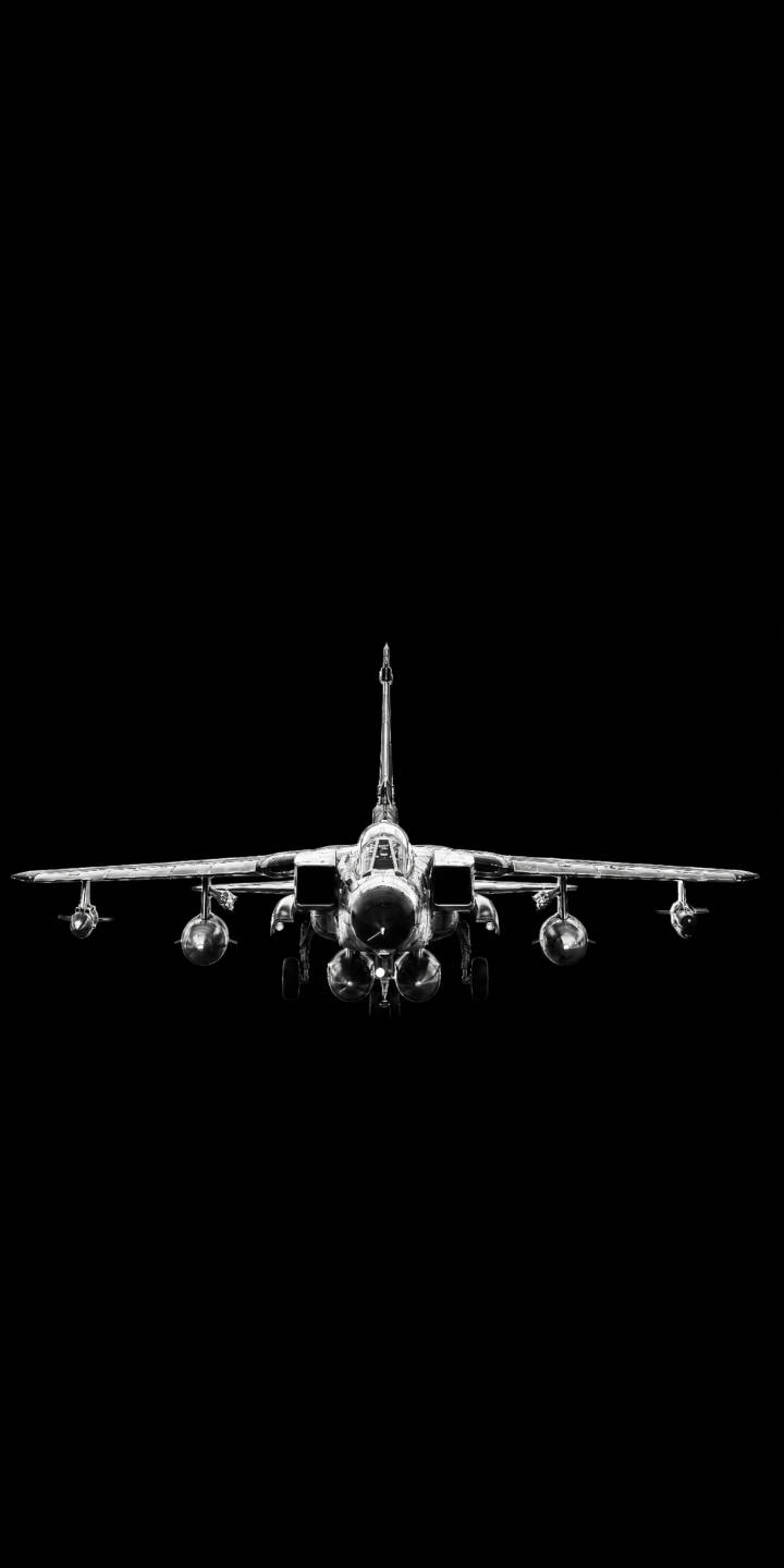 A powerful fighter jet in stark monochrome stares forward in this striking 4K wallpaper. This dynamic wallpaper, showcasing its sleek design and armed wings against a dark backdrop, is perfect for your iPhone. | jet iphone fighter jet minimalist wallpaper mobile 4k wallpaper hd wallpaper dark aesthetic monochrome military warplane A powerful fighter jet in stark monochrome stares forward in this striking 4K wallpaper. This dynamic wallpaper, showcasing its sleek design and armed wings against a dark backdrop, is perfect for your iPhone.