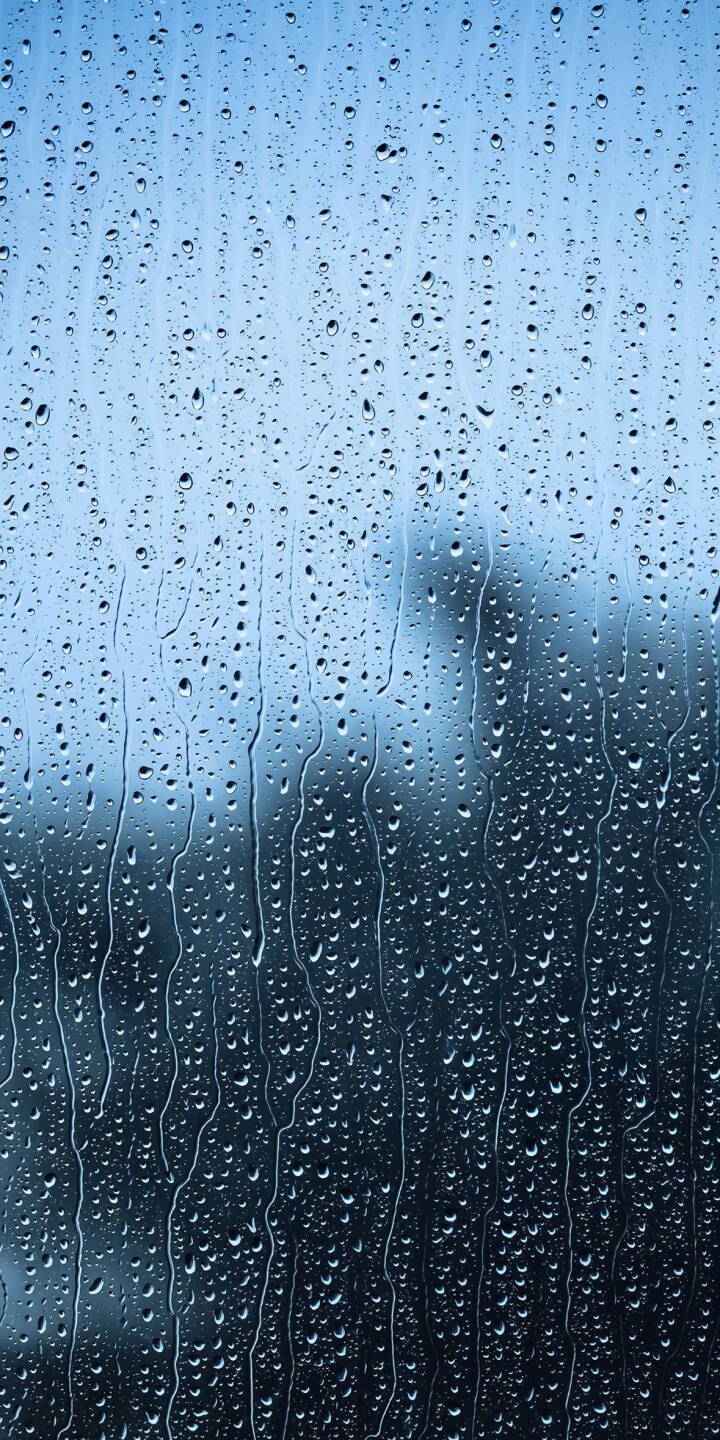 Tiny raindrops cling and streak across the window pane, blurring the gentle blue background in this calming 4K wallpaper — a perfect textured wallpaper for iPhone screens. | blue window rain iphone abstract wallpaper mobile 4k wallpaper hd wallpaper water drops atmospheric raindrops Tiny raindrops cling and streak across the window pane, blurring the gentle blue background in this calming 4K wallpaper — a perfect textured wallpaper for iPhone screens.