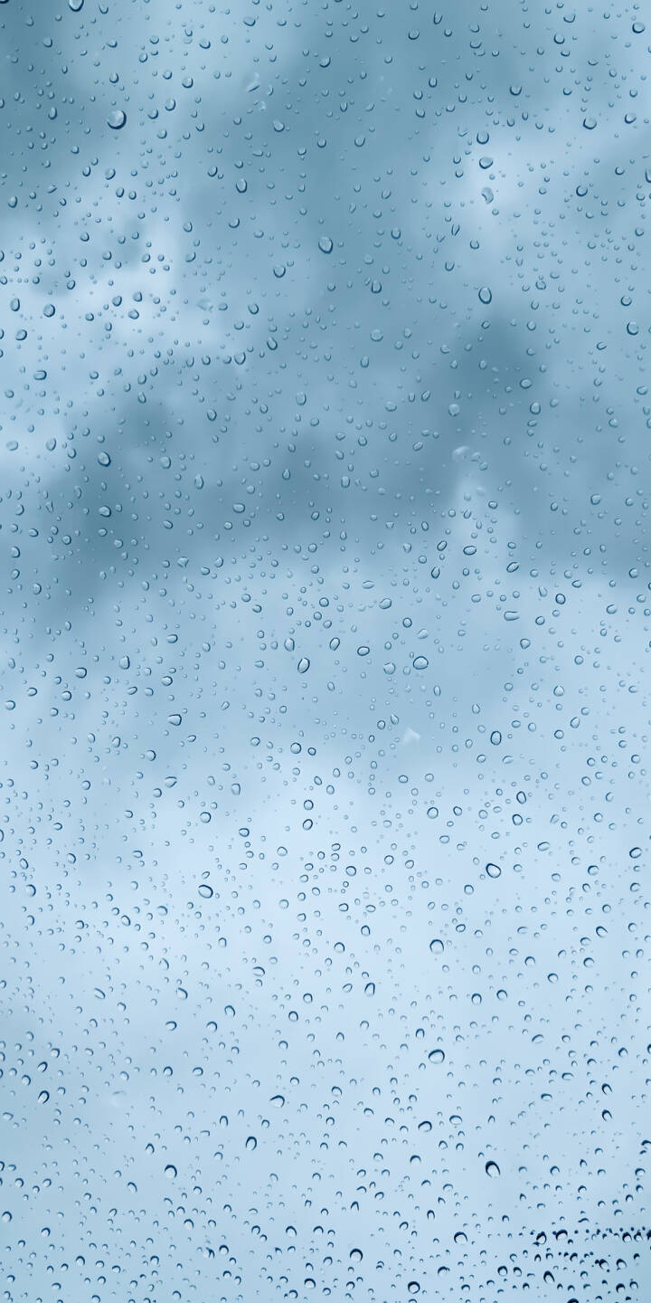 Thousands of glistening water droplets cling to a window pane, obscuring a soft, ethereal blue-grey sky in this peaceful 4K wallpaper. This serene atmospheric wallpaper is perfect for creating a calming backdrop on your iPhone. | aesthetic window calm rain iphone wallpaper mobile wet 4k wallpaper hd wallpaper serene raindrops Thousands of glistening water droplets cling to a window pane, obscuring a soft, ethereal blue-grey sky in this peaceful 4K wallpaper. This serene atmospheric wallpaper is perfect for creating a calming backdrop on your iPhone.
