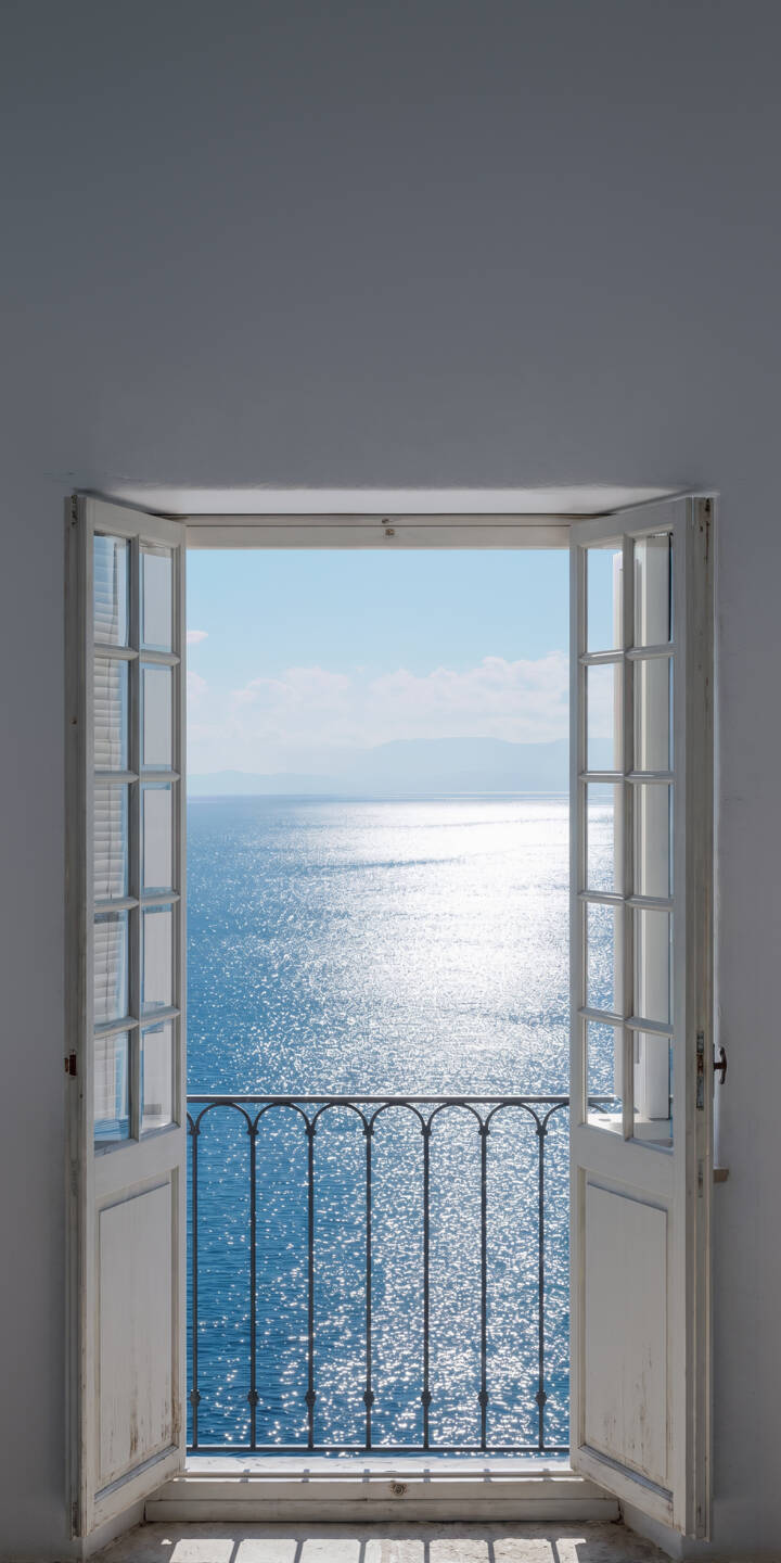 The brilliant sunlight reflects spectacularly across the deep blue ocean, visible through elegant open white window frames and a classic wrought iron balcony railing in this captivating 4K wallpaper. This stunning ocean view is a perfect wallpaper for your iPhone, bringing a refreshing coastal breeze to your screen. | window balcony iphone ocean minimalist wallpaper sparkling mobile sunlight 4k wallpaper hd wallpaper sea view The brilliant sunlight reflects spectacularly across the deep blue ocean, visible through elegant open white window frames and a classic wrought iron balcony railing in this captivating 4K wallpaper. This stunning ocean view is a perfect wallpaper for your iPhone, bringing a refreshing coastal breeze to your screen.