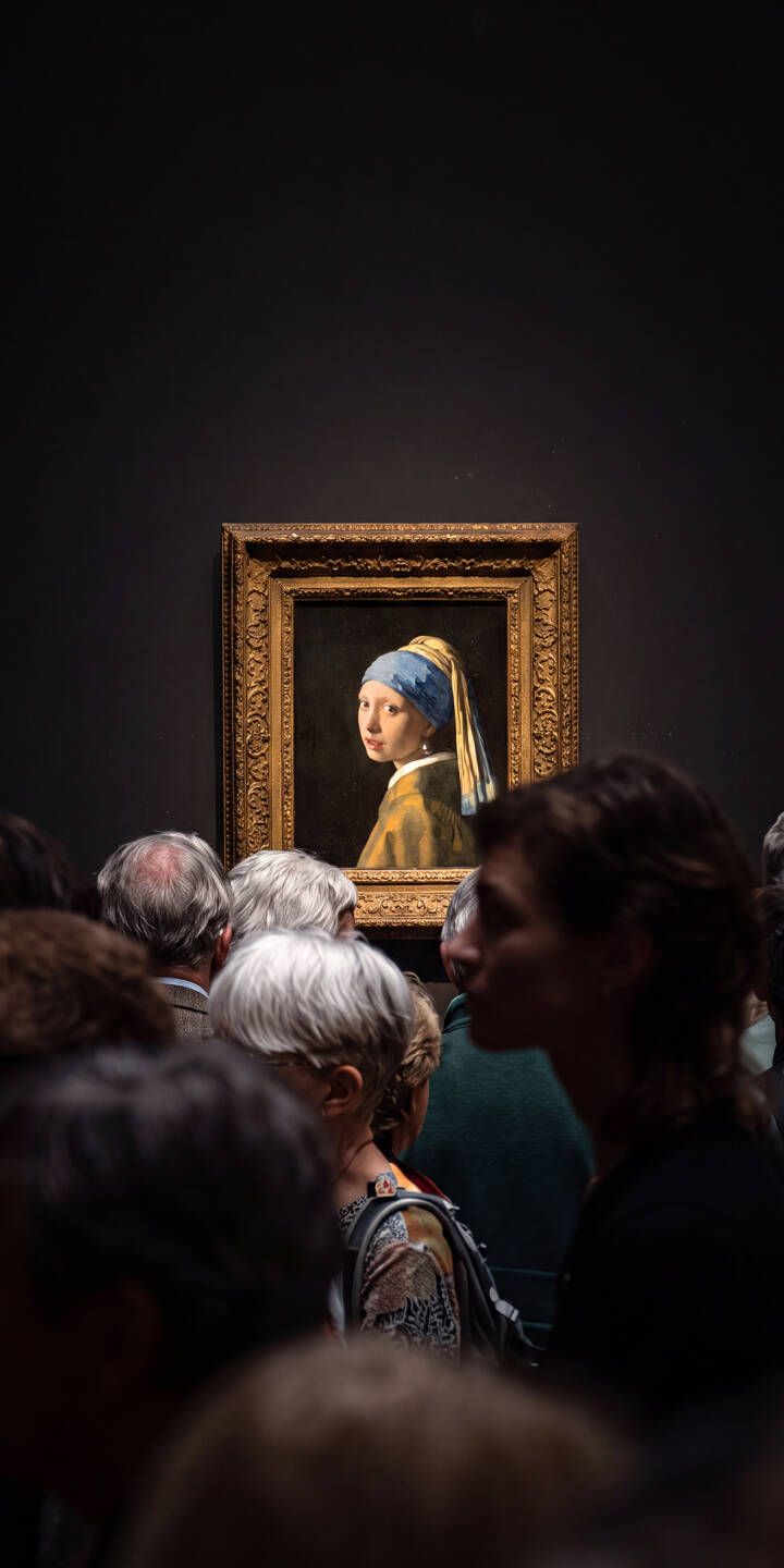 The enigmatic gaze of the Girl with a Pearl Earring captivates viewers in this stunning 4K wallpaper, framed by a golden ornate border. This iconic masterpiece offers a timeless artistic wallpaper for iPhone. | iphone wallpaper mobile 4k wallpaper hd wallpaper girl with a pearl earring baroque art vermeer johannes vermeer museum art dutch golden age classic painting The enigmatic gaze of the Girl with a Pearl Earring captivates viewers in this stunning 4K wallpaper, framed by a golden ornate border. This iconic masterpiece offers a timeless artistic wallpaper for iPhone.