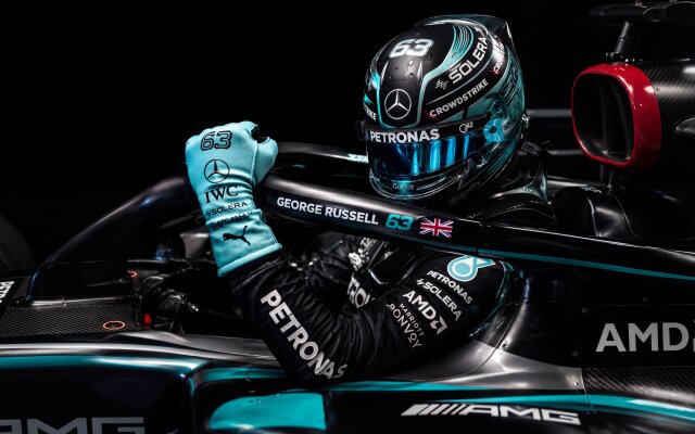 The vibrant cyan highlights of George Russell's helmet and raised gloved fist command attention from the sleek black Mercedes-AMG F1 cockpit. This 4K wallpaper captures the powerful racing aesthetic and intricate details, making it an ideal MacOS or MacBook wallpaper. | motorsport wallpaper racing macos formula 1 4k wallpaper hd wallpaper mercedes amg macbook imac george russell cyan aesthetic The vibrant cyan highlights of George Russell's helmet and raised gloved fist command attention from the sleek black Mercedes-AMG F1 cockpit. This 4K wallpaper captures the powerful racing aesthetic and intricate details, making it an ideal MacOS or MacBook wallpaper.