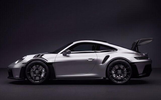 A stunning silver Porsche 911 GT3 RS takes center stage, gleaming with its aggressive rear wing and sleek black wheels on a dark studio background. This high-resolution 4K wallpaper offers an exquisite view of the luxury sports car, perfect for any MacBook or MacOS desktop wallpaper. | sports car porsche wallpaper macos porsche 911 silver car gt3 rs 4k wallpaper hd wallpaper automotive macbook imac A stunning silver Porsche 911 GT3 RS takes center stage, gleaming with its aggressive rear wing and sleek black wheels on a dark studio background. This high-resolution 4K wallpaper offers an exquisite view of the luxury sports car, perfect for any MacBook or MacOS desktop wallpaper.
