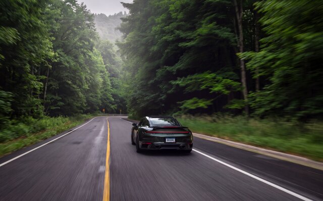 The sleek dark green Porsche 911 speeds down a winding forest road, surrounded by lush green trees, offering a dynamic and scenic 4K wallpaper for your MacBook. This captivating wallpaper captures the car's motion with subtle blur, perfect for any MacOS desktop. | sports car porsche wallpaper macos porsche 911 4k wallpaper hd wallpaper automotive scenic forest road macbook imac The sleek dark green Porsche 911 speeds down a winding forest road, surrounded by lush green trees, offering a dynamic and scenic 4K wallpaper for your MacBook. This captivating wallpaper captures the car's motion with subtle blur, perfect for any MacOS desktop.