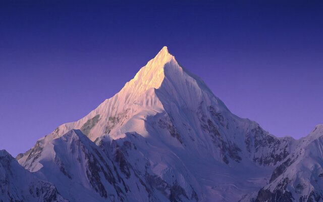 The sharp, sun-kissed peak of a majestic mountain pierces a vibrant twilight sky, creating an inspiring visual for your MacOS desktop. This stunning 4K wallpaper captures the tranquil beauty of nature with dramatic lighting and snow-covered ridges, making it an ideal MacBook wallpaper. | landscape mountain nature wallpaper alpine macos 4k wallpaper hd wallpaper purple sky snowy peak macbook imac The sharp, sun-kissed peak of a majestic mountain pierces a vibrant twilight sky, creating an inspiring visual for your MacOS desktop. This stunning 4K wallpaper captures the tranquil beauty of nature with dramatic lighting and snow-covered ridges, making it an ideal MacBook wallpaper.