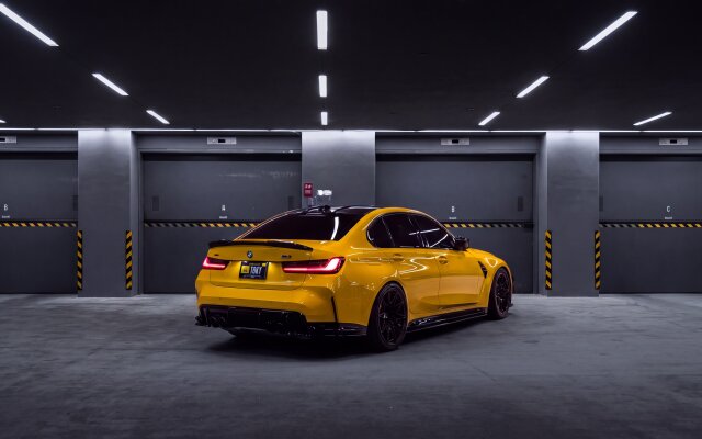 Striking in its bright yellow finish, this 4K BMW M3 G80 wallpaper showcases the sleek vehicle parked in a moody, dimly lit garage, its sharp LED taillights glowing. This premium car wallpaper is perfect for any MacOS or MacBook display, highlighting the car's dynamic black wheels and aggressive design. | sports car garage bmw m3 wallpaper macos g80 4k wallpaper hd wallpaper automotive macbook imac Striking in its bright yellow finish, this 4K BMW M3 G80 wallpaper showcases the sleek vehicle parked in a moody, dimly lit garage, its sharp LED taillights glowing. This premium car wallpaper is perfect for any MacOS or MacBook display, highlighting the car's dynamic black wheels and aggressive design.