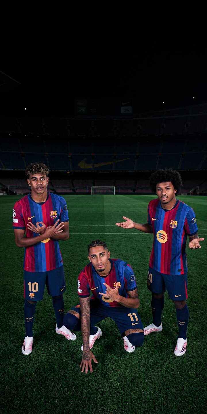 Raphinha kneels center alongside his FC Barcelona teammates, all striking dynamic poses in their vibrant blue and red kits on a dimly lit stadium pitch, creating a captivating 4K wallpaper. This dramatic player wallpaper for iPhone is perfect for showcasing your passion for soccer and FC Barcelona. | football stadium iphone soccer barcelona wallpaper raphinha players fc barcelona mobile 4k wallpaper hd wallpaper Raphinha kneels center alongside his FC Barcelona teammates, all striking dynamic poses in their vibrant blue and red kits on a dimly lit stadium pitch, creating a captivating 4K wallpaper. This dramatic player wallpaper for iPhone is perfect for showcasing your passion for soccer and FC Barcelona.