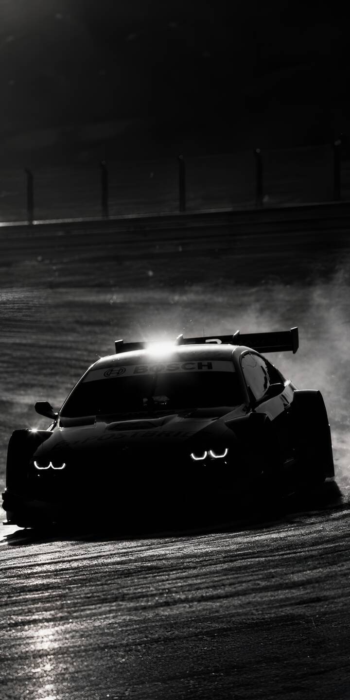 The intense U-shaped headlights pierce the darkness as this monochrome race car speeds across a track in this stunning 4K wallpaper. This dynamic wallpaper for iPhone truly captures the vehicle's powerful presence. | car dark bmw bmw m4 car aesthetic The intense U-shaped headlights pierce the darkness as this monochrome race car speeds across a track in this stunning 4K wallpaper. This dynamic wallpaper for iPhone truly captures the vehicle's powerful presence.