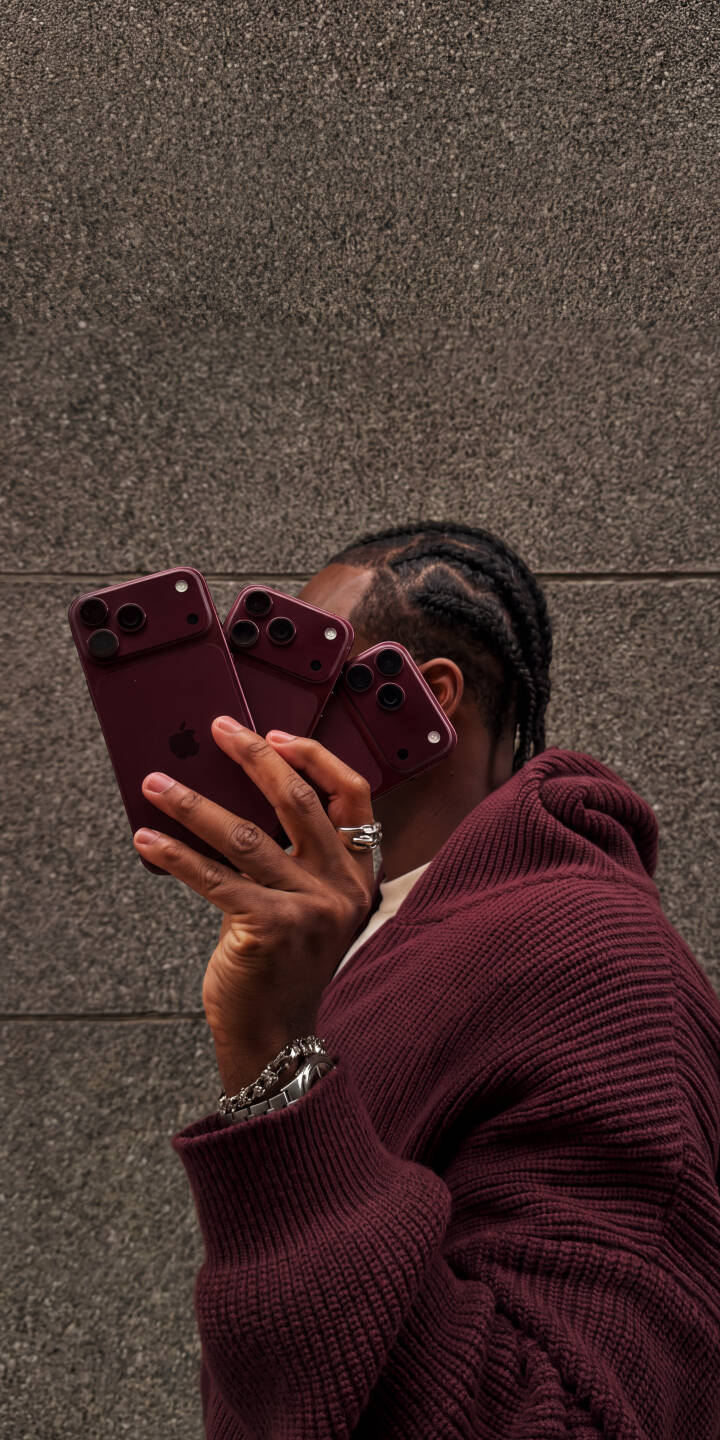 Three elegant deep purple iPhone 14 Pro devices are held prominently by a person wearing a matching sweater in this striking 4K wallpaper. This aesthetic display against a textured grey wall creates a luxurious iPhone wallpaper for enthusiasts. | aesthetic smartphone apple iphone luxury wallpaper tech mobile 4k wallpaper hd wallpaper iphone 14 pro deep purple iphone Three elegant deep purple iPhone 14 Pro devices are held prominently by a person wearing a matching sweater in this striking 4K wallpaper. This aesthetic display against a textured grey wall creates a luxurious iPhone wallpaper for enthusiasts.