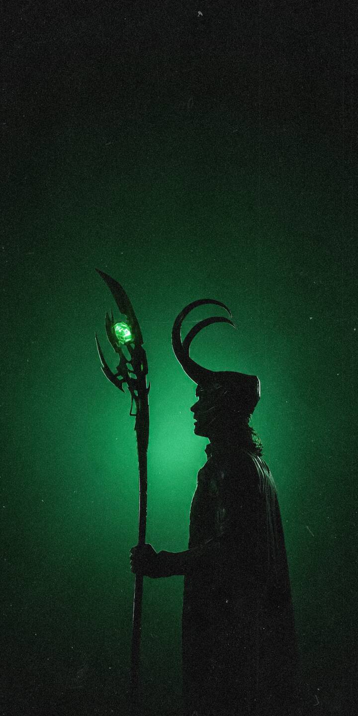 The vivid green aura silhouettes Loki, holding his scepter with a glowing gem in this striking 4K wallpaper for iPhone. This mysterious wallpaper captures the God of Mischief's iconic horned profile. | marvel iphone wallpaper silhouette mobile 4k wallpaper hd wallpaper mcu green aesthetic loki god of mischief scepter The vivid green aura silhouettes Loki, holding his scepter with a glowing gem in this striking 4K wallpaper for iPhone. This mysterious wallpaper captures the God of Mischief's iconic horned profile.
