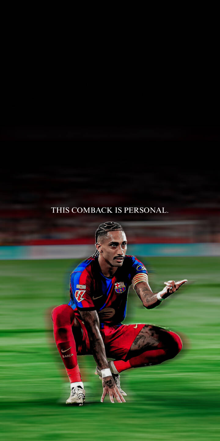 Raphinha strikes a fierce pose on the field, with his hand down and finger pointing, emblazoned with "THIS COMBACK IS PERSONAL." in this 4K wallpaper perfect for iPhone. This motivational wallpaper captures the essence of his determination for any fan. | sports football stadium athlete motivation iphone wallpaper raphinha fc barcelona mobile 4k wallpaper hd wallpaper Raphinha strikes a fierce pose on the field, with his hand down and finger pointing, emblazoned with "THIS COMBACK IS PERSONAL." in this 4K wallpaper perfect for iPhone. This motivational wallpaper captures the essence of his determination for any fan.
