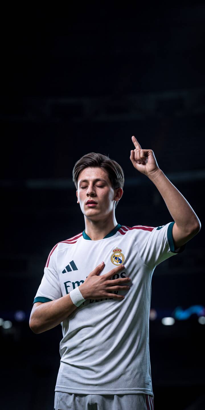 Arda Guler stands with eyes closed, one hand over his heart and his index finger pointing skyward in this powerful 4K wallpaper for Real Madrid fans. This celebratory moment makes an inspiring wallpaper for your iPhone. | football stadium athlete celebration iphone soccer real madrid wallpaper mobile arda güler 4k wallpaper hd wallpaper arda guler arda guler wallpaper arda guler player Arda Guler stands with eyes closed, one hand over his heart and his index finger pointing skyward in this powerful 4K wallpaper for Real Madrid fans. This celebratory moment makes an inspiring wallpaper for your iPhone.