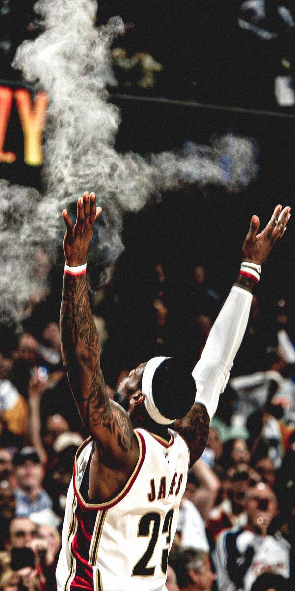 White chalk dust explodes around LeBron James as he raises his tattooed arms in an iconic pre-game ritual, wearing his classic Cleveland Cavaliers jersey. This stunning 4K wallpaper captures a legendary moment and is a perfect mobile wallpaper for your iPhone. | sports White chalk dust explodes around LeBron James as he raises his tattooed arms in an iconic pre-game ritual, wearing his classic Cleveland Cavaliers jersey. This stunning 4K wallpaper captures a legendary moment and is a perfect mobile wallpaper for your iPhone.