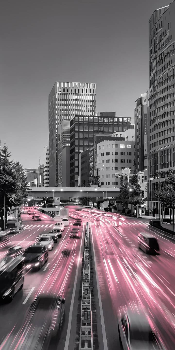 Vibrant pink light trails streak through a black and white cityscape, illuminating the urban grid in this mesmerizing 4K wallpaper, ideal for any iPhone screen. This dynamic street scene captures motion, providing a captivating mobile wallpaper experience. | aesthetic city urban iphone wallpaper long exposure mobile 4k wallpaper hd wallpaper light trails pink lights Vibrant pink light trails streak through a black and white cityscape, illuminating the urban grid in this mesmerizing 4K wallpaper, ideal for any iPhone screen. This dynamic street scene captures motion, providing a captivating mobile wallpaper experience.