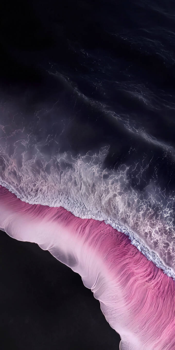 Vivid pink sand forms a striking contrast with the deep blue-black ocean and foamy white waves in this stunning 4K wallpaper. This captivating aerial wallpaper for iPhone offers a unique and aesthetic view. | aesthetic iphone nature abstract ocean waves wallpaper mobile 4k wallpaper hd wallpaper pink beach Vivid pink sand forms a striking contrast with the deep blue-black ocean and foamy white waves in this stunning 4K wallpaper. This captivating aerial wallpaper for iPhone offers a unique and aesthetic view.