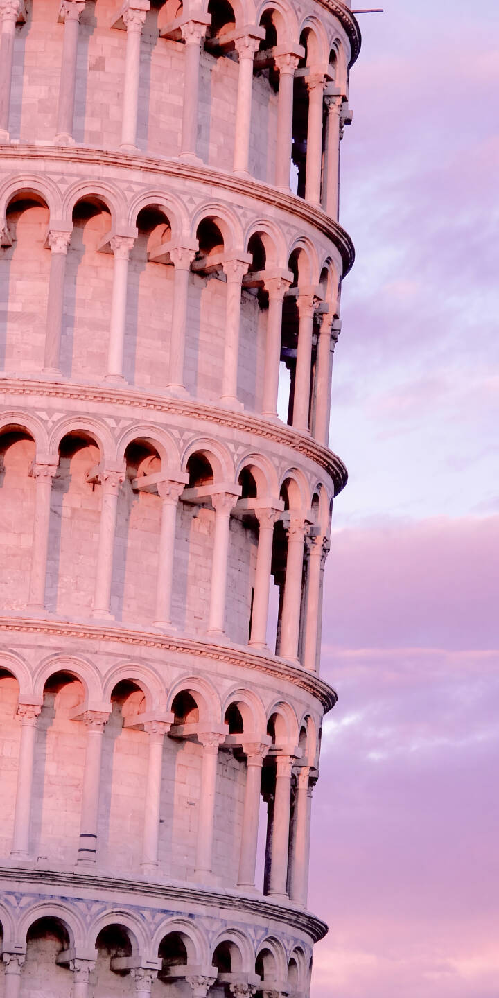 Soft pink and lavender hues paint the sky behind the iconic Leaning Tower of Pisa, its classical arches bathed in warm light in this stunning 4K wallpaper. This romantic European architectural wallpaper is a perfect choice for your iPhone. | aesthetic sunset architecture iphone wallpaper mobile italy 4k wallpaper hd wallpaper pink sky pisa leaning tower Soft pink and lavender hues paint the sky behind the iconic Leaning Tower of Pisa, its classical arches bathed in warm light in this stunning 4K wallpaper. This romantic European architectural wallpaper is a perfect choice for your iPhone.