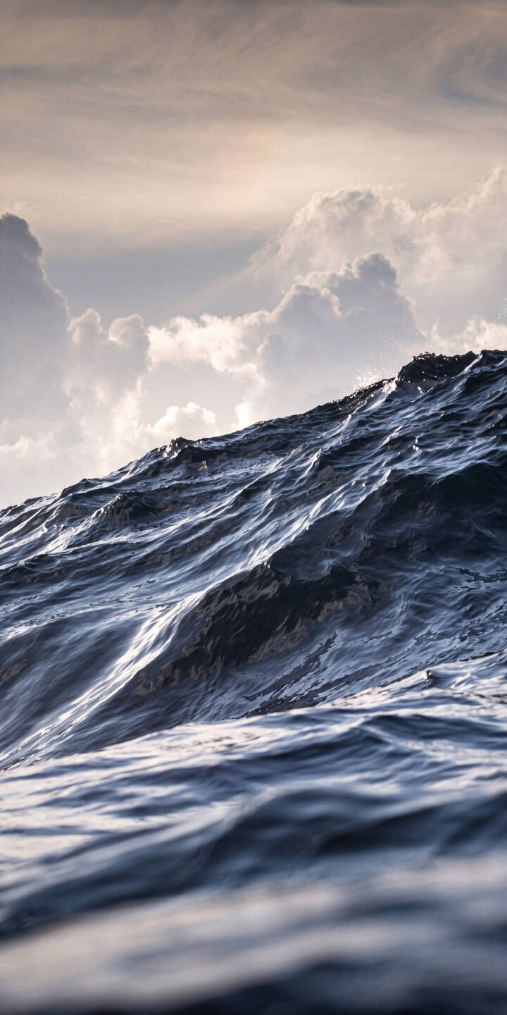 Sunlight spectacularly catches the crests of dark, textured waves, creating a dynamic visual in this stunning 4K wallpaper for iPhone. The dramatic sky with fluffy clouds above adds to the serene yet powerful mood of this ocean wallpaper. | aesthetic blue sea water iphone nature ocean waves wallpaper mobile 4k wallpaper hd wallpaper Sunlight spectacularly catches the crests of dark, textured waves, creating a dynamic visual in this stunning 4K wallpaper for iPhone. The dramatic sky with fluffy clouds above adds to the serene yet powerful mood of this ocean wallpaper.