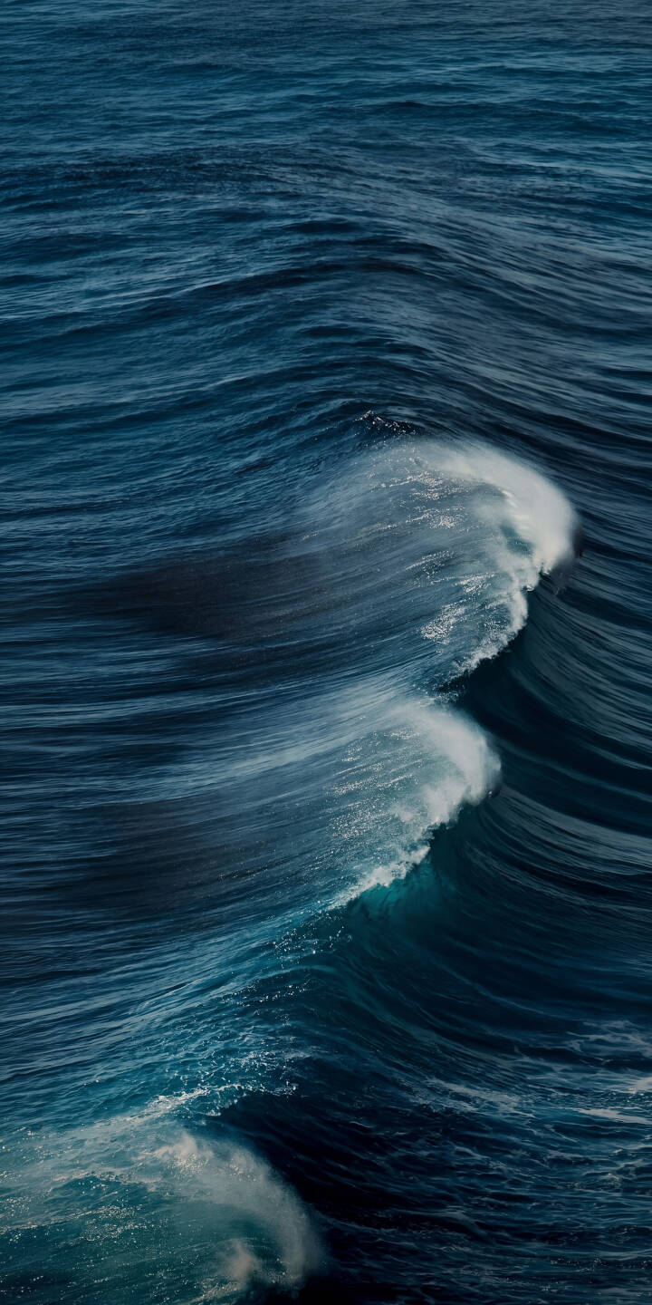 Foamy white crests beautifully break over the powerful deep blue ocean waves in this stunning 4K wallpaper - a truly dynamic ocean wallpaper perfect for iPhone screens. | aesthetic blue sea water iphone nature ocean waves wallpaper mobile 4k wallpaper hd wallpaper Foamy white crests beautifully break over the powerful deep blue ocean waves in this stunning 4K wallpaper - a truly dynamic ocean wallpaper perfect for iPhone screens.