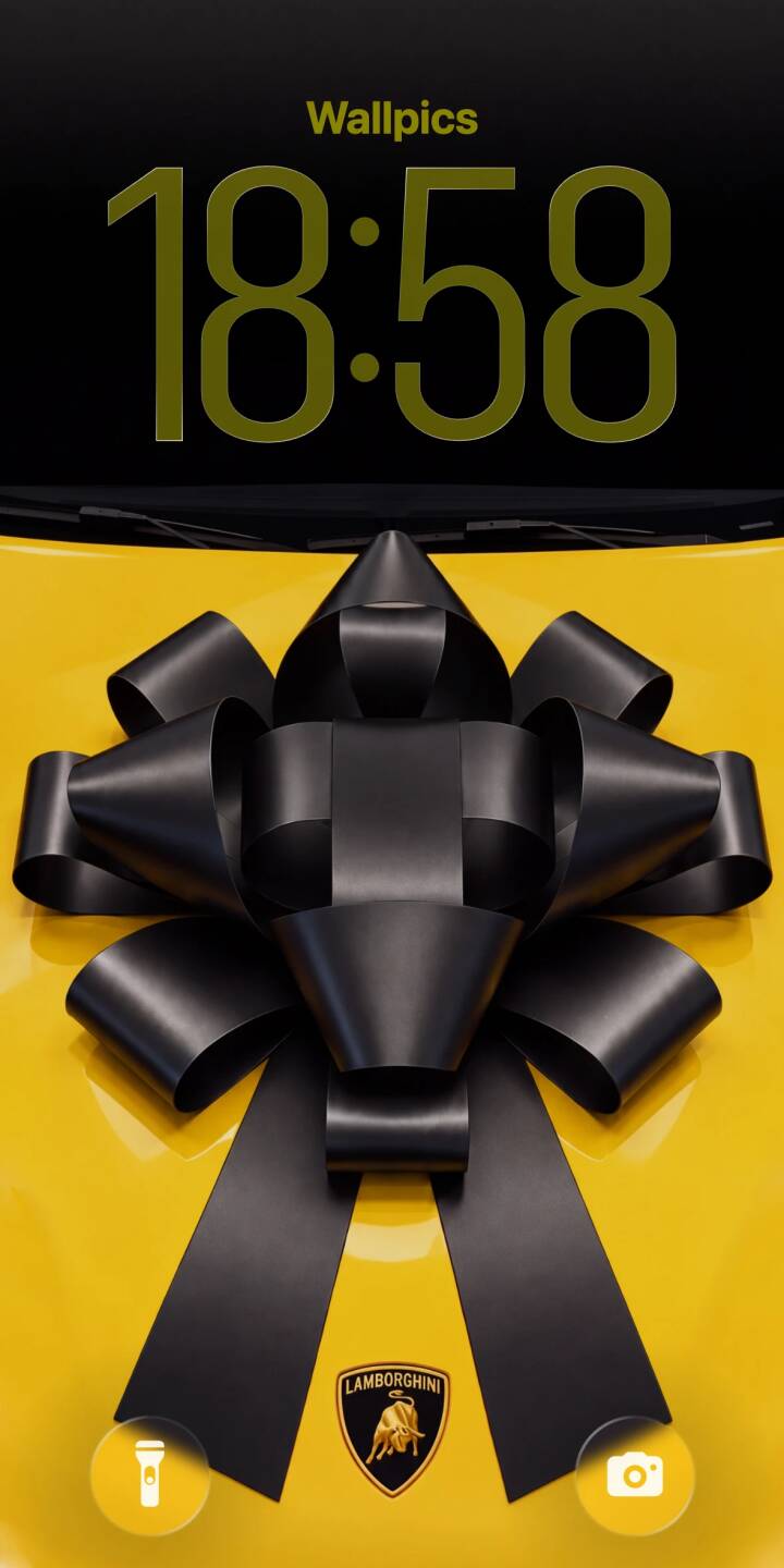 A sleek, enormous black bow adorns the vibrant yellow hood of a luxurious Lamborghini, complete with its iconic golden emblem, making this a stunning 4K wallpaper for iPhone. This premium car wallpaper is perfect for automotive enthusiasts. | iphone lamborghini supercar wallpaper mobile luxury car yellow car 4k wallpaper hd wallpaper automotive black bow gift car A sleek, enormous black bow adorns the vibrant yellow hood of a luxurious Lamborghini, complete with its iconic golden emblem, making this a stunning 4K wallpaper for iPhone. This premium car wallpaper is perfect for automotive enthusiasts.