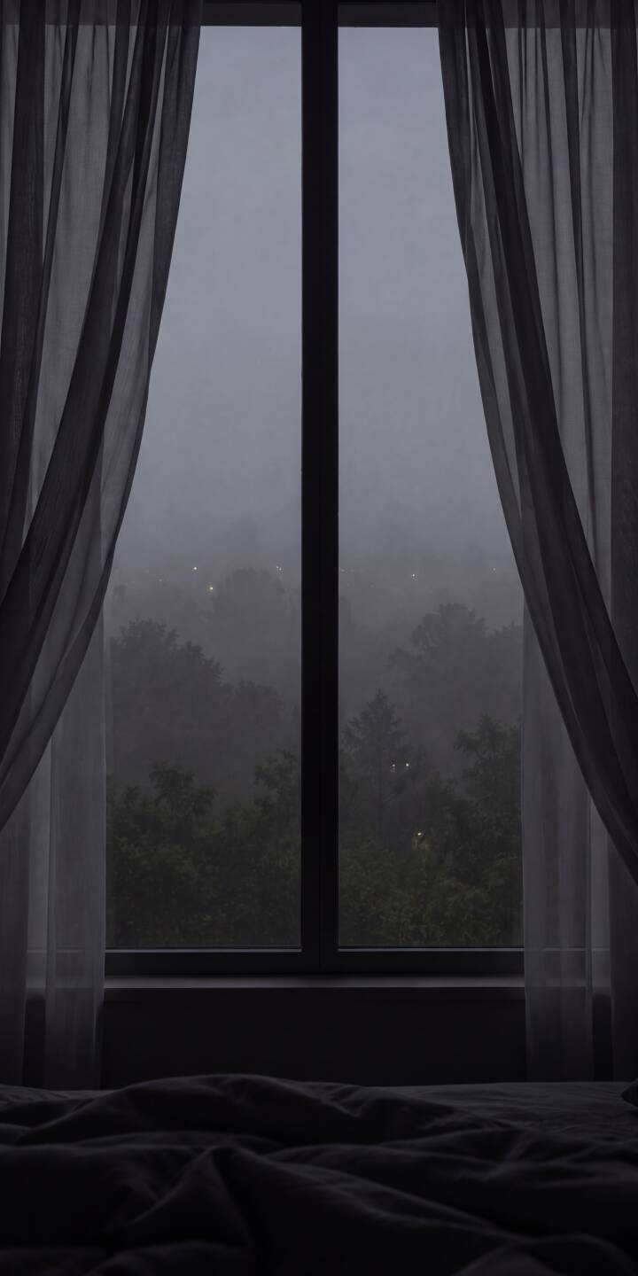 Gentle gray sheer curtains softly frame a window looking out onto a misty, tree-filled landscape with distant shimmering lights in this serene 4K wallpaper for iPhone. This tranquil view creates a perfect peaceful atmosphere as a cozy bedroom wallpaper. | forest window foggy iphone wallpaper mobile curtains 4k wallpaper hd wallpaper dark aesthetic cozy bedroom misty view Gentle gray sheer curtains softly frame a window looking out onto a misty, tree-filled landscape with distant shimmering lights in this serene 4K wallpaper for iPhone. This tranquil view creates a perfect peaceful atmosphere as a cozy bedroom wallpaper.