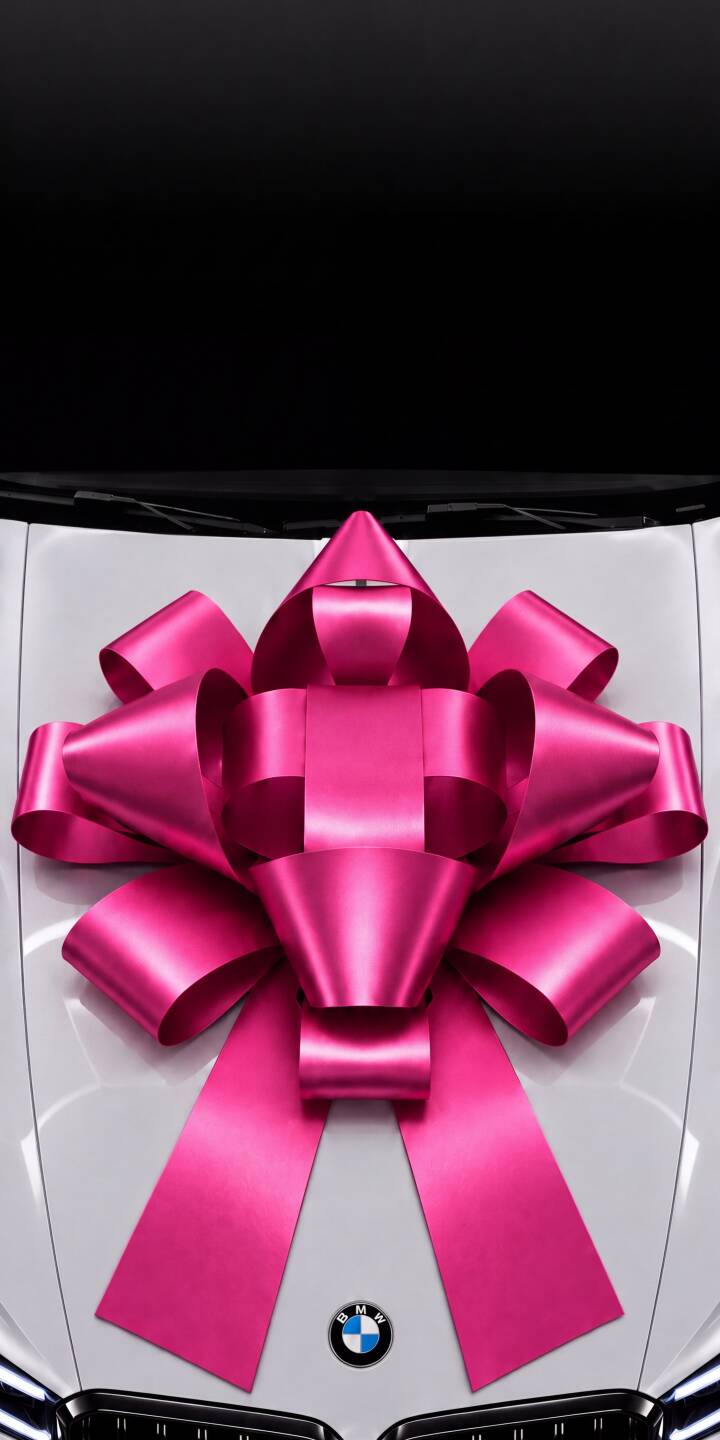 A striking pink satin bow adorns the sleek white hood of a BMW car in this luxurious 4K wallpaper, making it a perfect gift wallpaper for your iPhone. | aesthetic car iphone bmw luxury wallpaper mobile 4k wallpaper hd wallpaper automotive pink bow gift A striking pink satin bow adorns the sleek white hood of a BMW car in this luxurious 4K wallpaper, making it a perfect gift wallpaper for your iPhone.