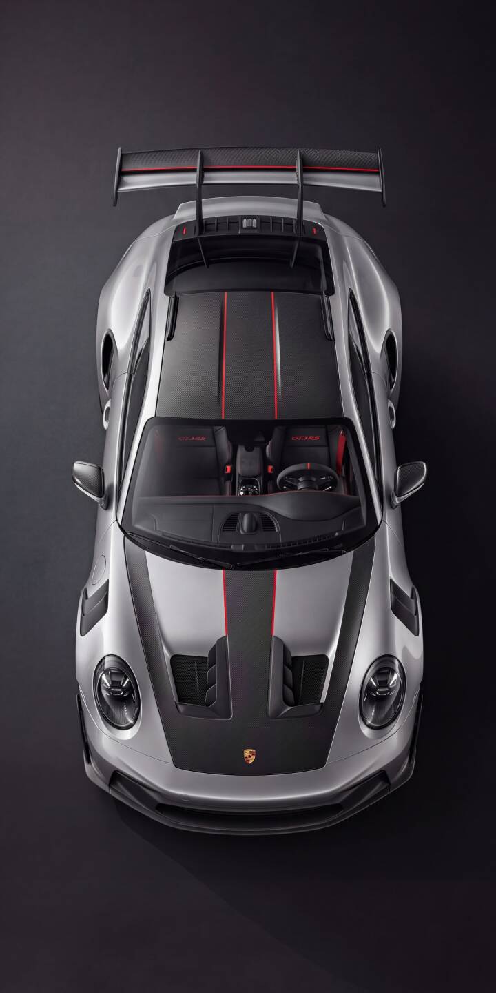 The Porsche 911 GT3 RS gleams in a striking top-down view, showcasing its sleek silver finish and prominent red racing stripes in this stunning 4K wallpaper. This high-performance car makes an ideal wallpaper for your iPhone. | sports car iphone porsche supercar wallpaper mobile luxury car silver car gt3 rs 4k wallpaper hd wallpaper racing stripes The Porsche 911 GT3 RS gleams in a striking top-down view, showcasing its sleek silver finish and prominent red racing stripes in this stunning 4K wallpaper. This high-performance car makes an ideal wallpaper for your iPhone.