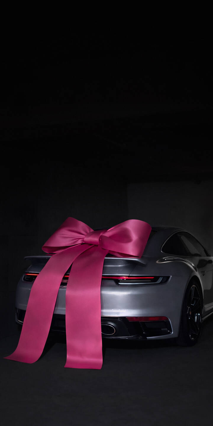 A magnificent hot pink bow adorns the sleek silver Porsche 911, transforming this luxury vehicle into a stunning gift in this dramatic 4K wallpaper — an exquisite choice for any iPhone wallpaper enthusiast. | aesthetic sports car iphone porsche wallpaper mobile luxury car porsche 911 4k wallpaper hd wallpaper pink bow gift A magnificent hot pink bow adorns the sleek silver Porsche 911, transforming this luxury vehicle into a stunning gift in this dramatic 4K wallpaper — an exquisite choice for any iPhone wallpaper enthusiast.
