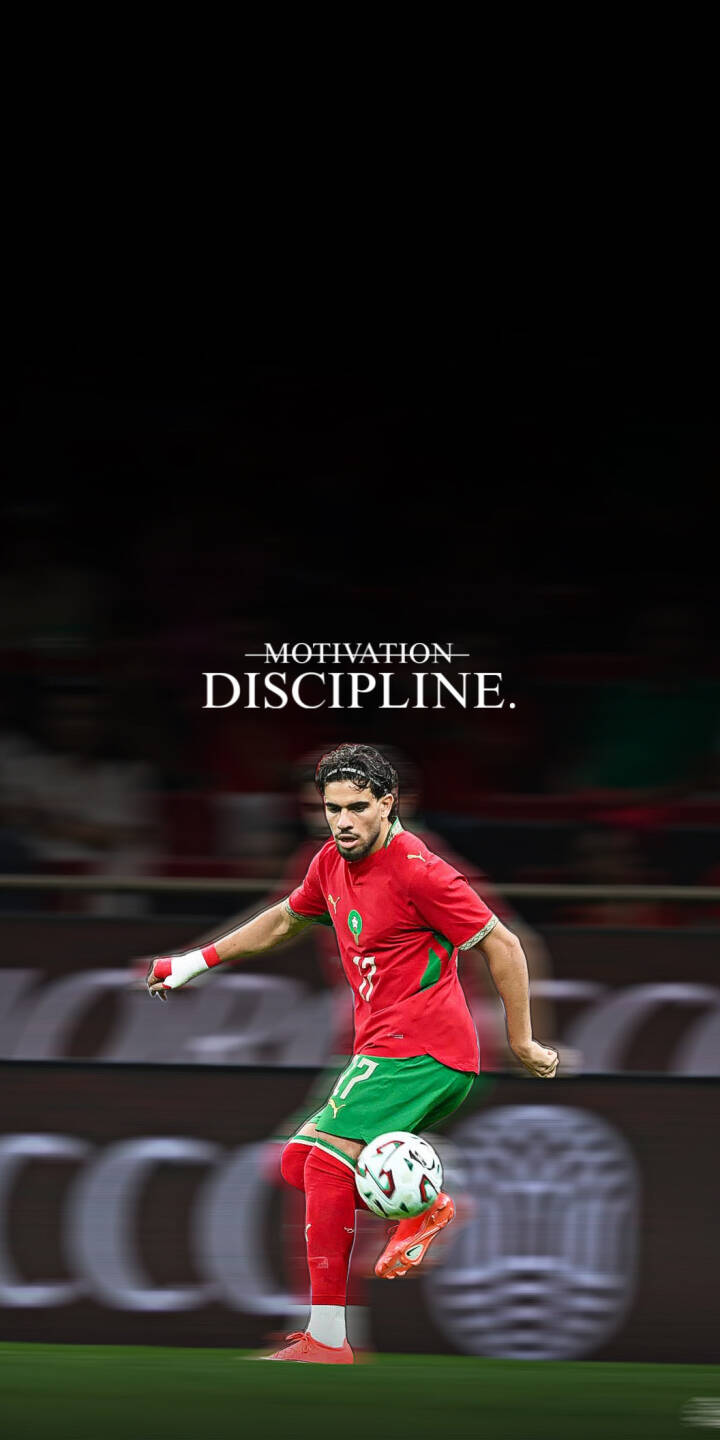 A Moroccan footballer in his vibrant red and green jersey dynamically kicks the ball across the field, with 'MOTIVATION' and 'DISCIPLINE' text boldly displayed above in this stunning 4K wallpaper — an inspiring wallpaper perfect for your iPhone. | sports football motivation discipline iphone soccer wallpaper mobile 4k wallpaper hd wallpaper morocco ezzalzouli A Moroccan footballer in his vibrant red and green jersey dynamically kicks the ball across the field, with 'MOTIVATION' and 'DISCIPLINE' text boldly displayed above in this stunning 4K wallpaper — an inspiring wallpaper perfect for your iPhone.