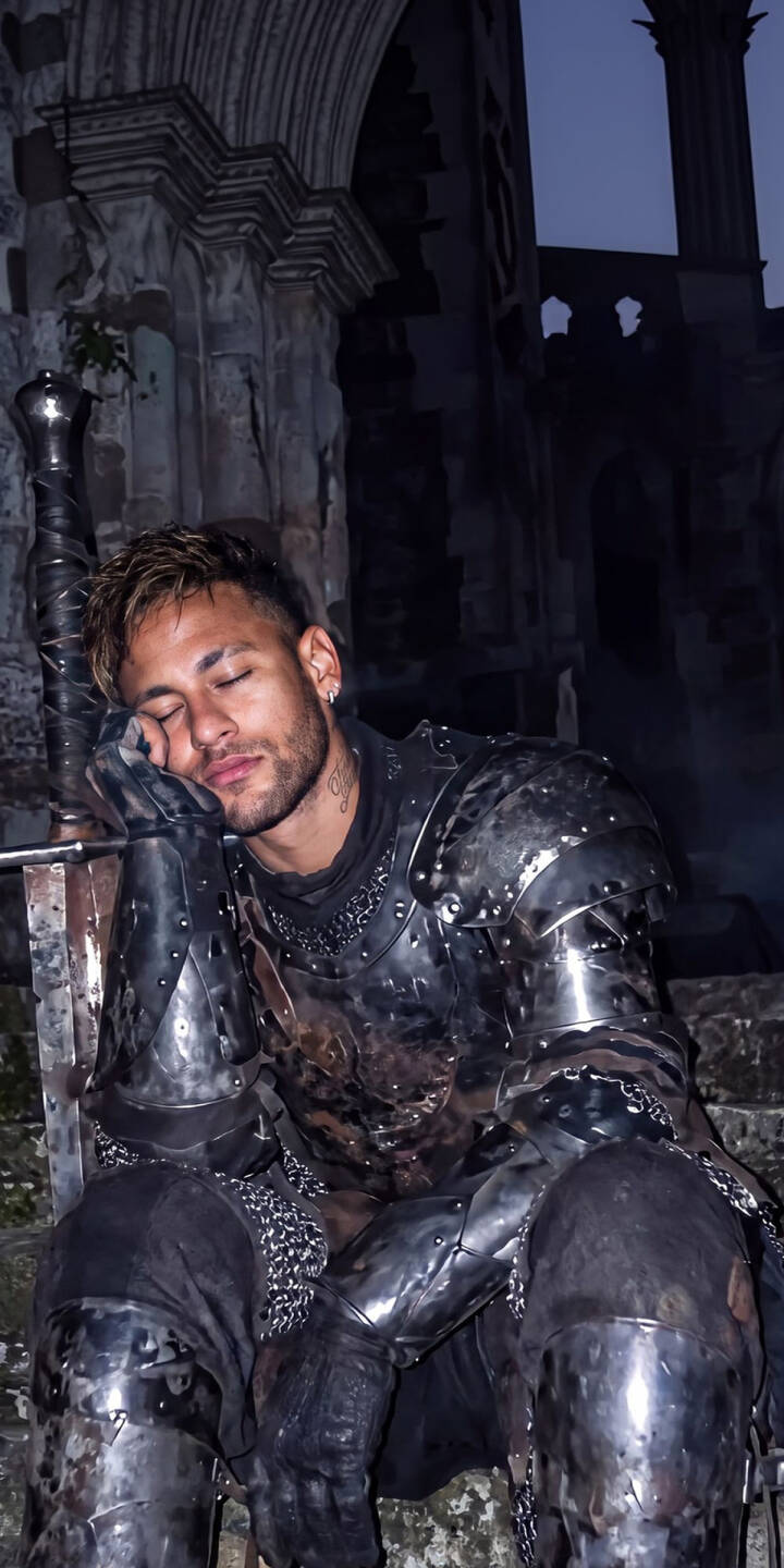 Neymar's eyes are softly closed as he rests, clad in gleaming dark medieval armor and holding a large sword against the backdrop of ancient ruins in this striking 4K wallpaper. This captivating wallpaper is perfect for iPhone users who appreciate a blend of modern celebrity and fantasy imagery. | armor knight medieval iphone fantasy wallpaper neymar mobile footballer 4k wallpaper hd wallpaper dreamy Neymar's eyes are softly closed as he rests, clad in gleaming dark medieval armor and holding a large sword against the backdrop of ancient ruins in this striking 4K wallpaper. This captivating wallpaper is perfect for iPhone users who appreciate a blend of modern celebrity and fantasy imagery.