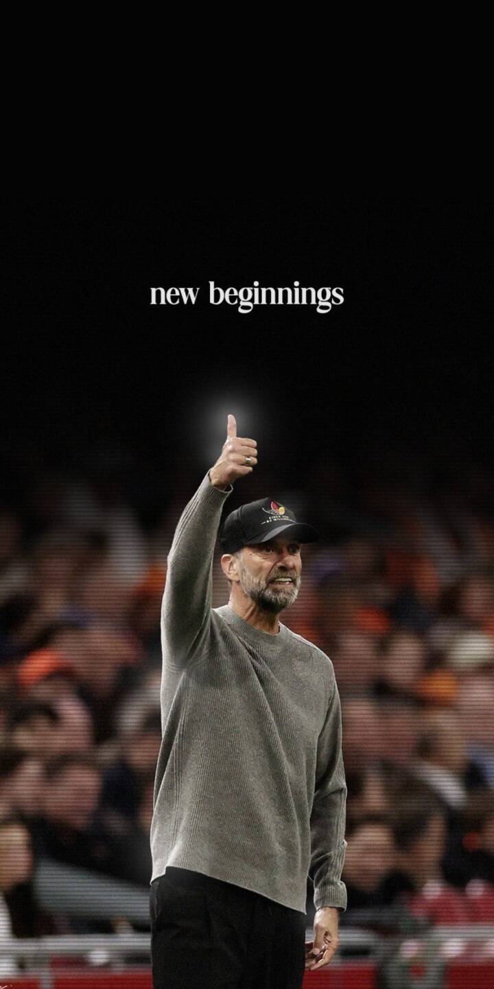 The inspiring text 'new beginnings' floats prominently above Jürgen Klopp, who offers a reassuring thumbs-up with a calm expression in this emotional 4K wallpaper. This stunning wallpaper for iPhone perfectly captures his gesture amidst the blurred stadium lights, making it an ideal background. | sports football iphone wallpaper mobile 4k wallpaper hd wallpaper inspirational manager jurgen klopp klopp new beginnings The inspiring text 'new beginnings' floats prominently above Jürgen Klopp, who offers a reassuring thumbs-up with a calm expression in this emotional 4K wallpaper. This stunning wallpaper for iPhone perfectly captures his gesture amidst the blurred stadium lights, making it an ideal background.