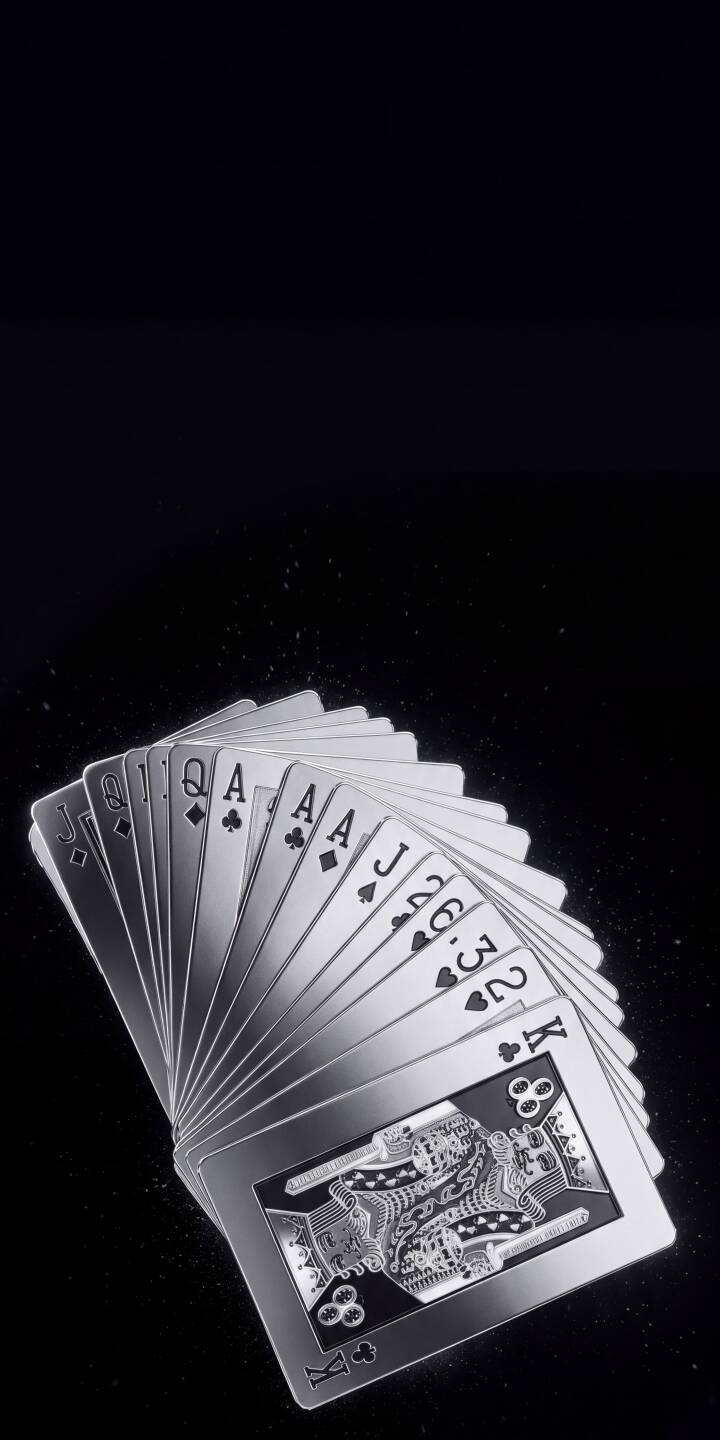 A striking fan of silvery metal playing cards elegantly spreads across a dark, minimalist background in this stunning 4K wallpaper. This captivating metallic card wallpaper is a premium choice for iPhone users seeking a sophisticated aesthetic. | silver iphone luxury wallpaper mobile 4k wallpaper hd wallpaper dark aesthetic playing cards metal cards poker cards deck of cards A striking fan of silvery metal playing cards elegantly spreads across a dark, minimalist background in this stunning 4K wallpaper. This captivating metallic card wallpaper is a premium choice for iPhone users seeking a sophisticated aesthetic.