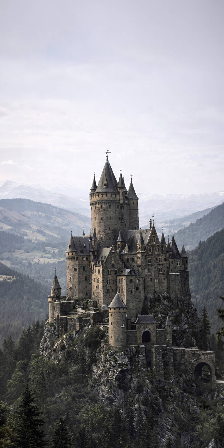 Perched dramatically on a rugged, tree-covered peak, this majestic stone castle with its intricate spires overlooks misty mountain ranges. This breathtaking 4K wallpaper offers an epic fairytale scene, ideal as an inspiring iPhone wallpaper for fantasy enthusiasts. | castle medieval iphone fantasy mountains wallpaper mobile 4k wallpaper hd wallpaper epic historical fortress Perched dramatically on a rugged, tree-covered peak, this majestic stone castle with its intricate spires overlooks misty mountain ranges. This breathtaking 4K wallpaper offers an epic fairytale scene, ideal as an inspiring iPhone wallpaper for fantasy enthusiasts.