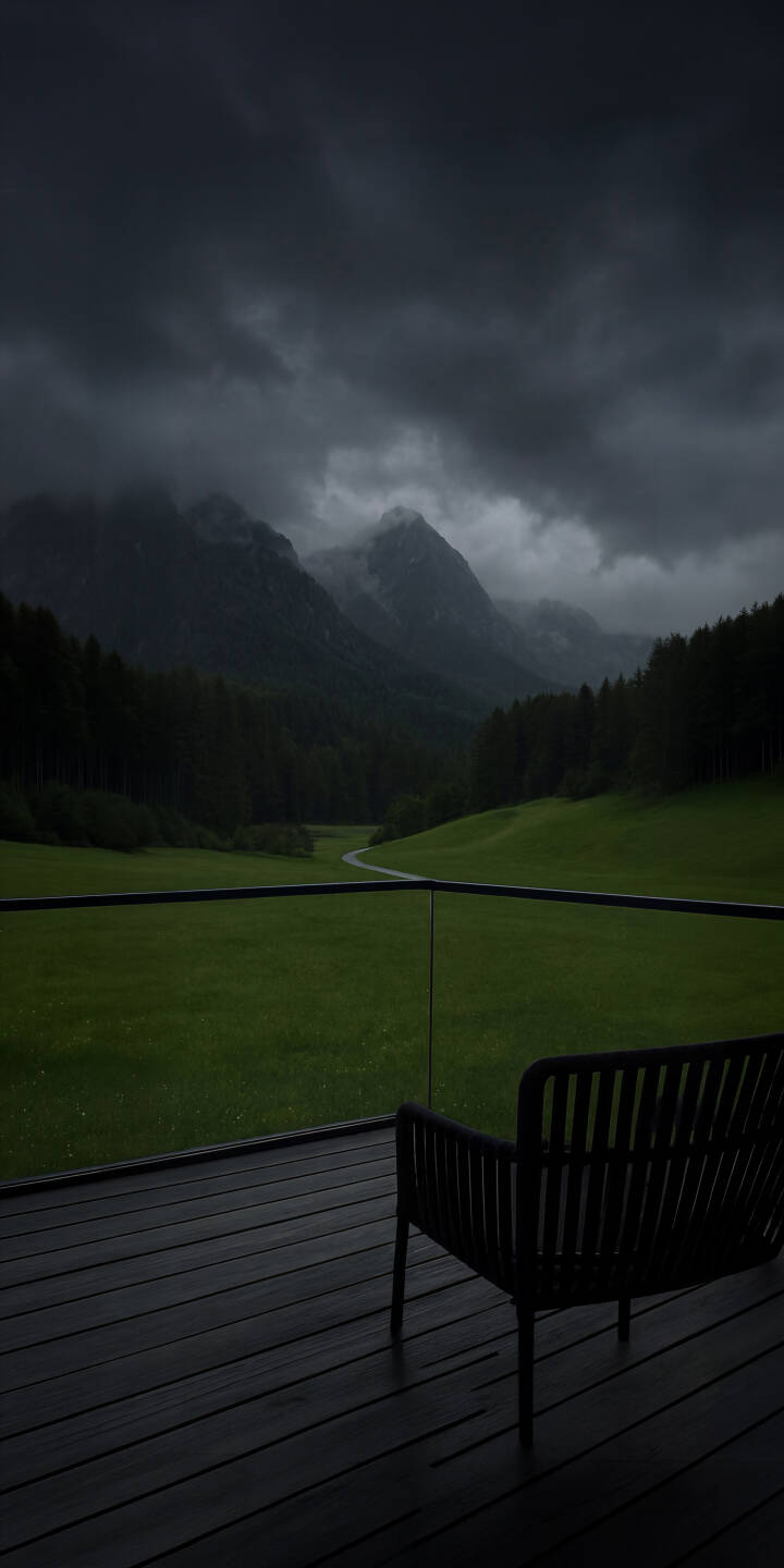 Dramatic storm clouds loom over majestic dark mountain peaks, framing a lush green valley with a winding path in this captivating 4K wallpaper. This moody atmospheric wallpaper, featuring a secluded balcony chair, is perfect for your iPhone. | landscape forest dark iphone nature mountains wallpaper mobile moody 4k wallpaper hd wallpaper atmospheric Dramatic storm clouds loom over majestic dark mountain peaks, framing a lush green valley with a winding path in this captivating 4K wallpaper. This moody atmospheric wallpaper, featuring a secluded balcony chair, is perfect for your iPhone.