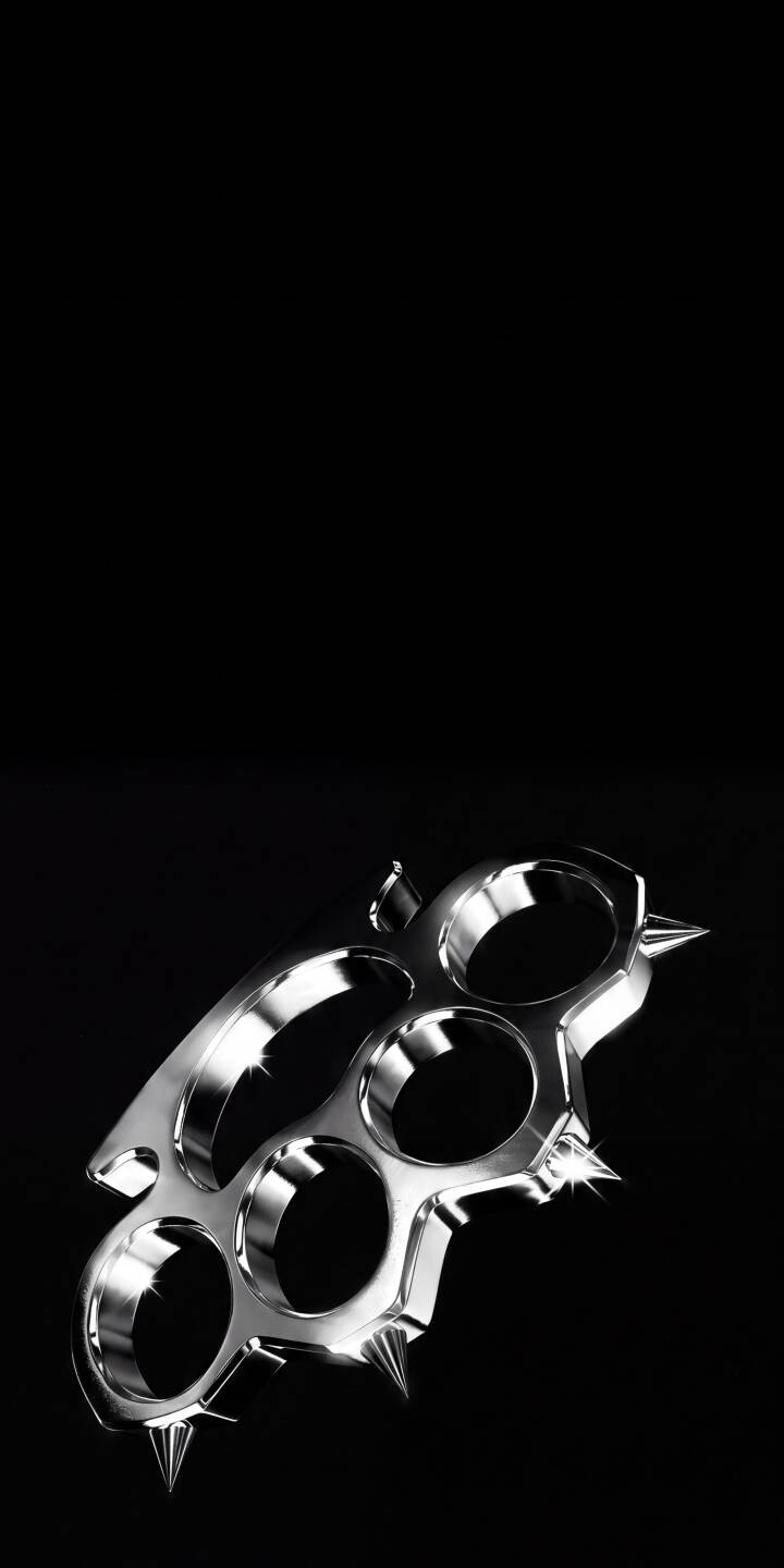 A sharp contrast of gleaming, spiked brass knuckles against a deep black background defines this menacing 4K wallpaper. This captivating reflective metal wallpaper is perfect for personalizing your iPhone. | dark weapon chrome iphone wallpaper mobile metallic 4k wallpaper hd wallpaper edgy brass knuckles spiked A sharp contrast of gleaming, spiked brass knuckles against a deep black background defines this menacing 4K wallpaper. This captivating reflective metal wallpaper is perfect for personalizing your iPhone.