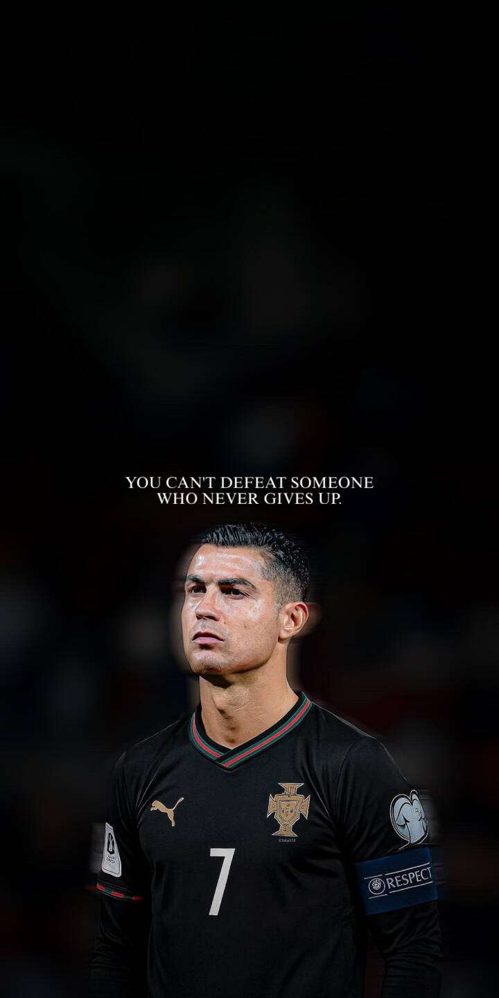 Cristiano Ronaldo's intense gaze and black Portugal kit are prominently featured in this powerful 4K wallpaper for iPhone. The inspiring text, "YOU CAN'T DEFEAT SOMEONE WHO NEVER GIVES UP," adds a strong motivational message to this striking wallpaper. | football motivational iphone ronaldo wallpaper cr7 cristiano ronaldo mobile never give up 4k wallpaper hd wallpaper black kit Cristiano Ronaldo's intense gaze and black Portugal kit are prominently featured in this powerful 4K wallpaper for iPhone. The inspiring text, "YOU CAN'T DEFEAT SOMEONE WHO NEVER GIVES UP," adds a strong motivational message to this striking wallpaper.