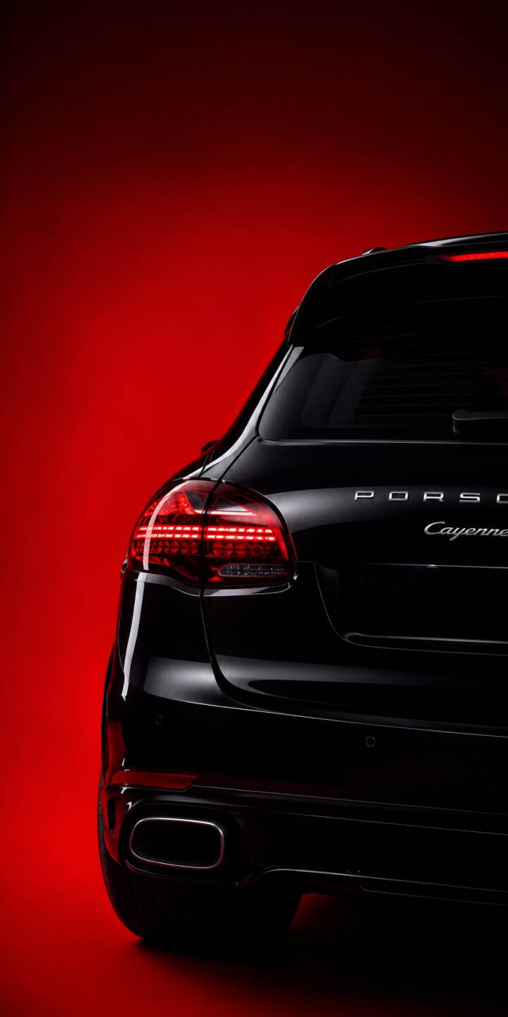 The sleek, illuminated taillights of the black Porsche Cayenne glow vibrantly against a deep red background in this stunning 4K wallpaper. This luxury car wallpaper is perfect for personalizing your iPhone. | 4k cars 4k porsche 4k iphone wallpaper The sleek, illuminated taillights of the black Porsche Cayenne glow vibrantly against a deep red background in this stunning 4K wallpaper. This luxury car wallpaper is perfect for personalizing your iPhone.
