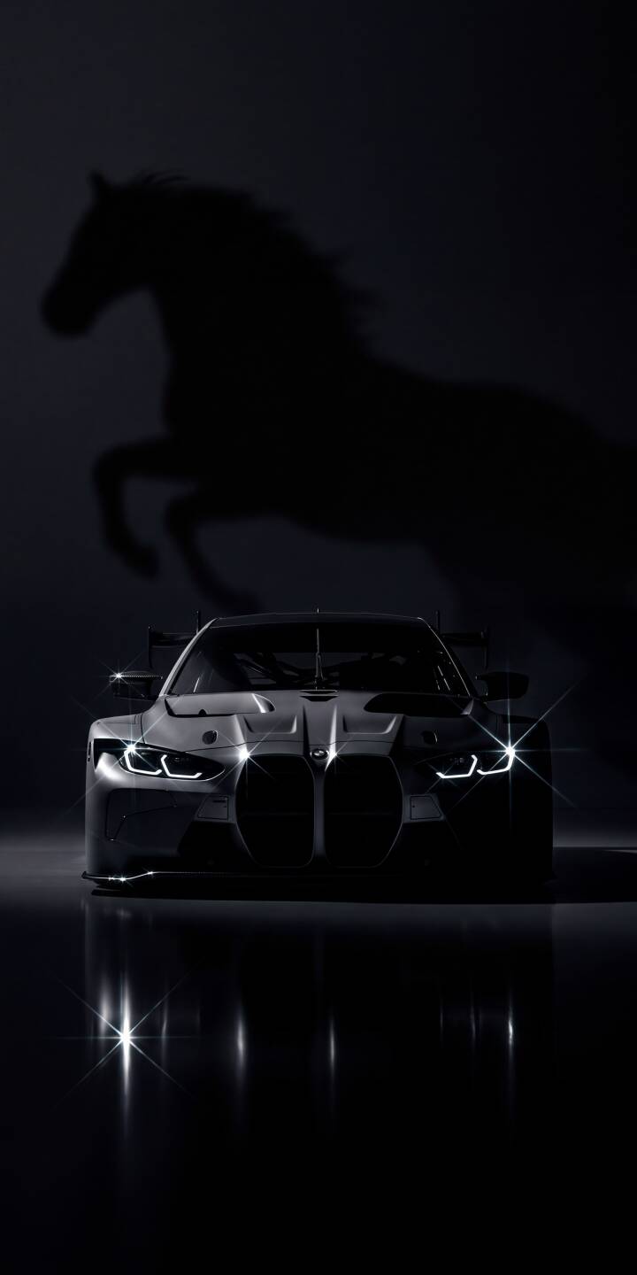 The sleek BMW M4 GT3's angular headlights shine brightly against the dark backdrop, with the ethereal silhouette of a leaping horse hinting at untamed power in this stunning 4K wallpaper. This dynamic car wallpaper is perfect for any iPhone, adding a touch of speed and mystery to your screen. | aesthetic sports car dark horse iphone bmw wallpaper silhouette bmw m4 mobile 4k wallpaper hd wallpaper The sleek BMW M4 GT3's angular headlights shine brightly against the dark backdrop, with the ethereal silhouette of a leaping horse hinting at untamed power in this stunning 4K wallpaper. This dynamic car wallpaper is perfect for any iPhone, adding a touch of speed and mystery to your screen.