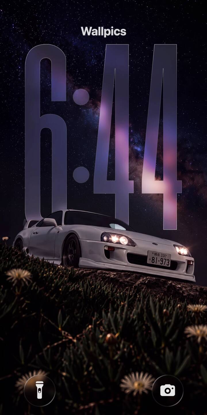 The brilliant Milky Way galaxy shines above a pristine white Toyota Supra, headlights illuminating the foreground foliage, making a breathtaking 4K wallpaper. This stunning automotive wallpaper is perfect for your iPhone screen. | sports car night sky iphone supra wallpaper milky way toyota supra mobile 4k wallpaper hd wallpaper jdm The brilliant Milky Way galaxy shines above a pristine white Toyota Supra, headlights illuminating the foreground foliage, making a breathtaking 4K wallpaper. This stunning automotive wallpaper is perfect for your iPhone screen.