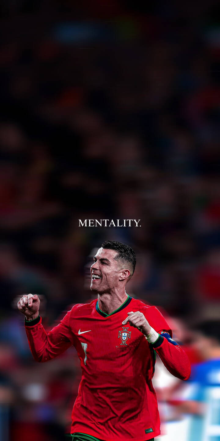 Cristiano Ronaldo's triumphant smile shines brightly under the "MENTALITY." text in this compelling 4K wallpaper, capturing his passion while wearing the iconic red Portugal kit. This inspirational wallpaper is perfect for any iPhone. | sports football celebration iphone ronaldo wallpaper cr7 portugal cristiano ronaldo mobile 4k wallpaper hd wallpaper Cristiano Ronaldo's triumphant smile shines brightly under the "MENTALITY." text in this compelling 4K wallpaper, capturing his passion while wearing the iconic red Portugal kit. This inspirational wallpaper is perfect for any iPhone.